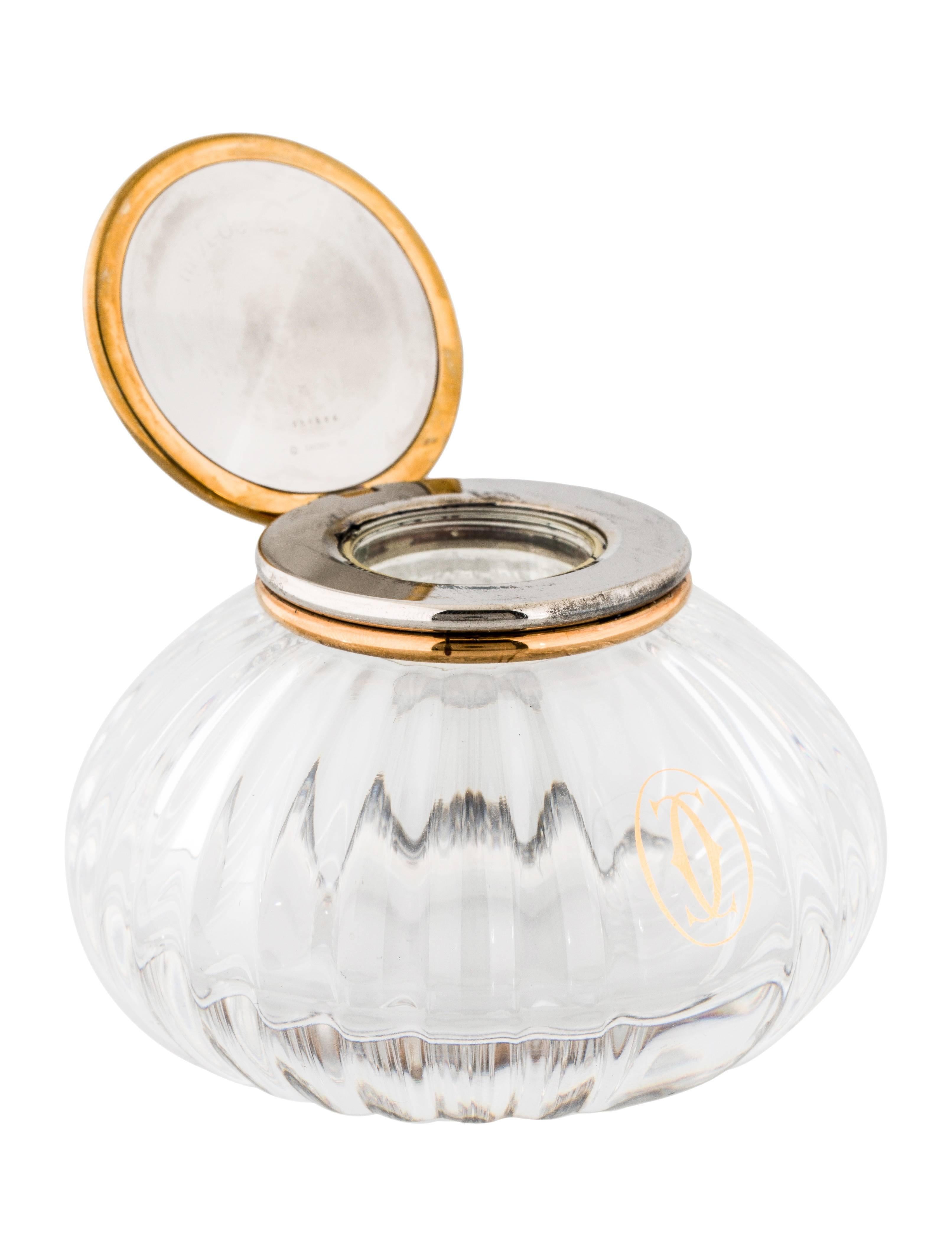 CURATOR'S NOTES

Crystal
Cabochon 
Silver and gold tone rim 
Hinge closure 
Height 2.5"
Diameter 3.25"
Includes box

Shop Newfound Luxury for authentic vintage Cartier home decor accessories.
