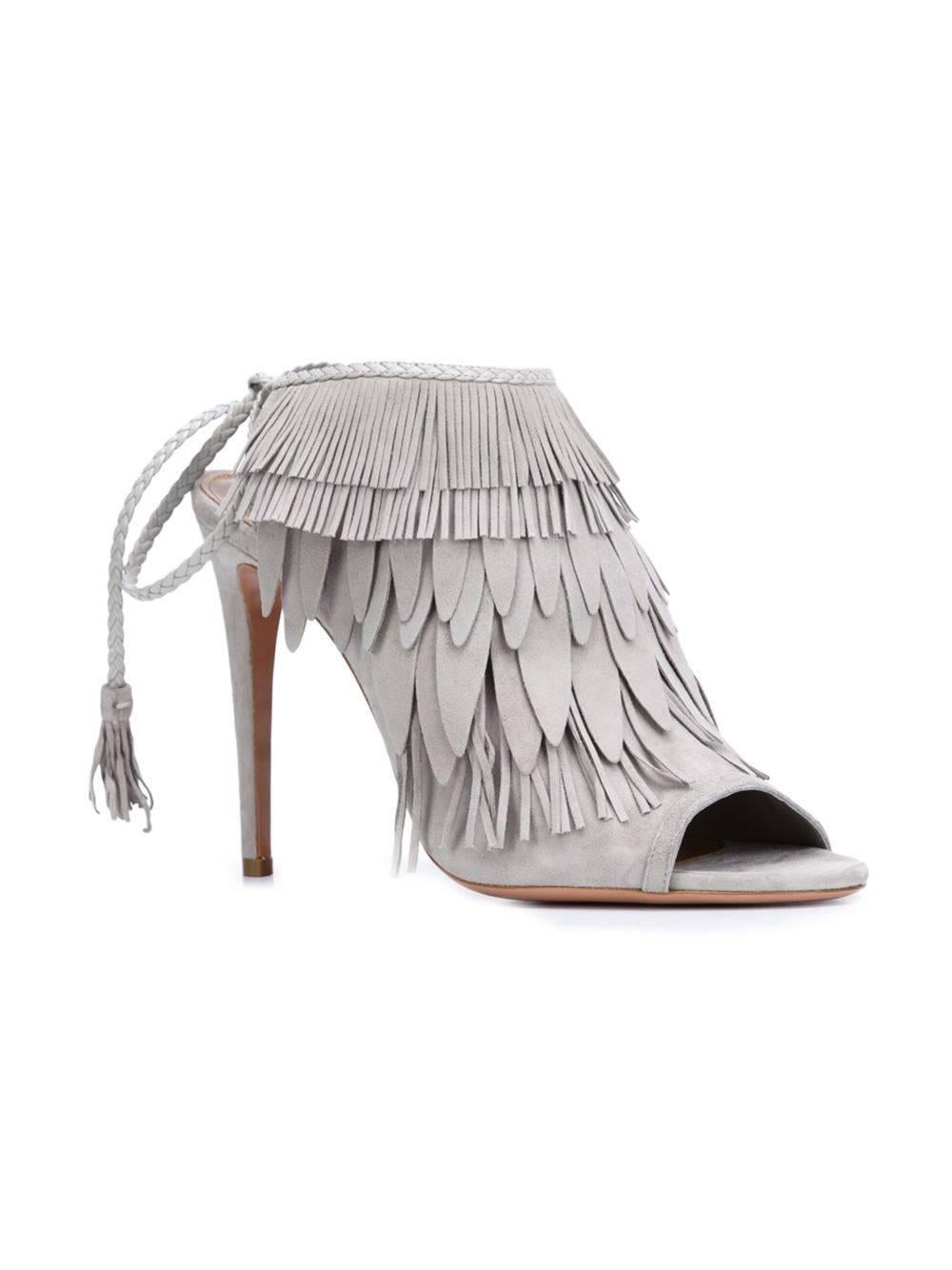 CURATOR'S NOTES   

Aquazzura NEW & SOLD OUT Gray Suede Tassel Evening Heels Sandals in Box  

Size IT 39
Suede  
Tie closures at ankles  
Made in Italy  
Heel heigh 4" 
Includes original Aquazzura dust bag and box   

Shop Newfound Luxury