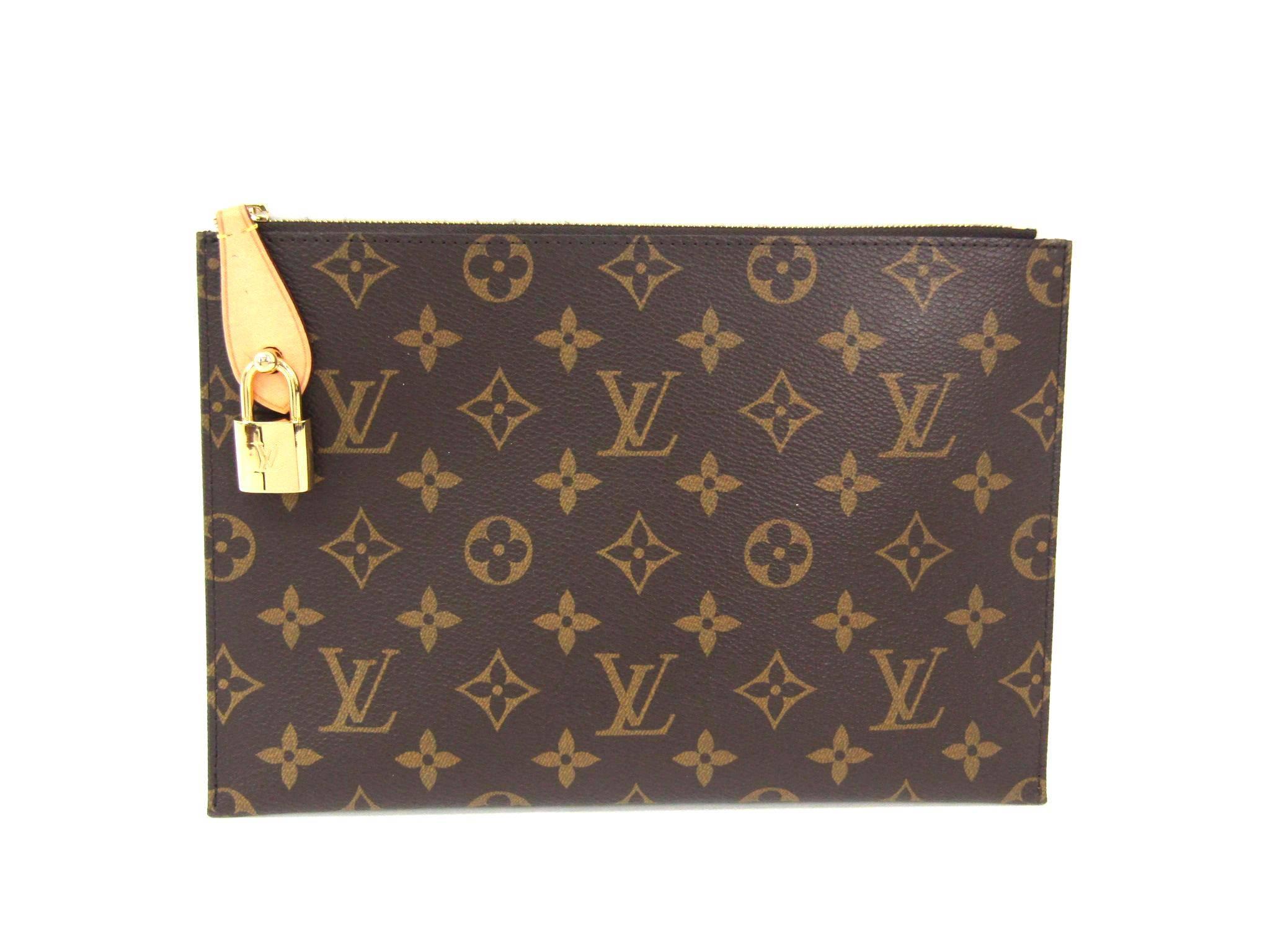 Louis Vuitton Monogram Rare Men's Women's Travel Carryall Clutch Bag With Keys 

Monogram canvas
Leather trim
Gold tone hardware
Zipper closure
Made in France
Date code SF2144
Measures 10" W x 6.7" H 
Include original Louis Vuitton padlock