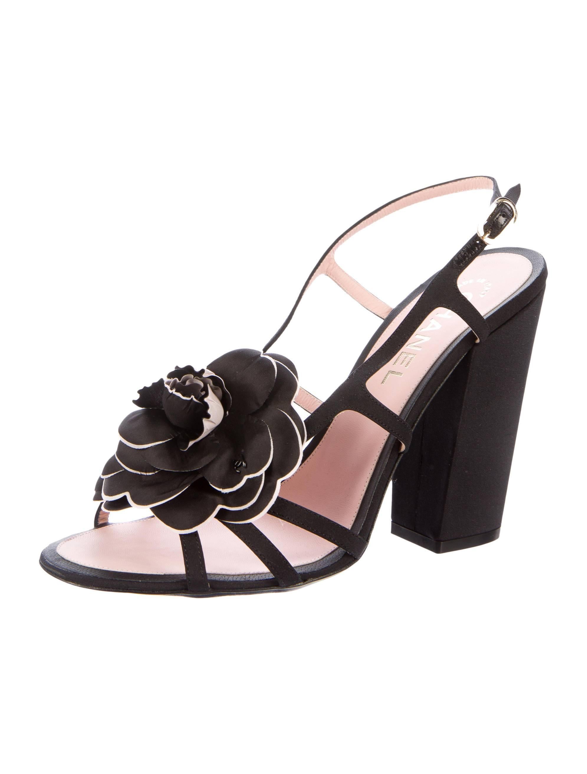 CURATOR'S NOTES

Chanel NEW & SOLD OUT Black Flower Cut Out Sandals Heels in Box 

Size IT 40
Satin
Buckle closure
Made in Italy
Heel height 4.5"
Includes box original Chanel box