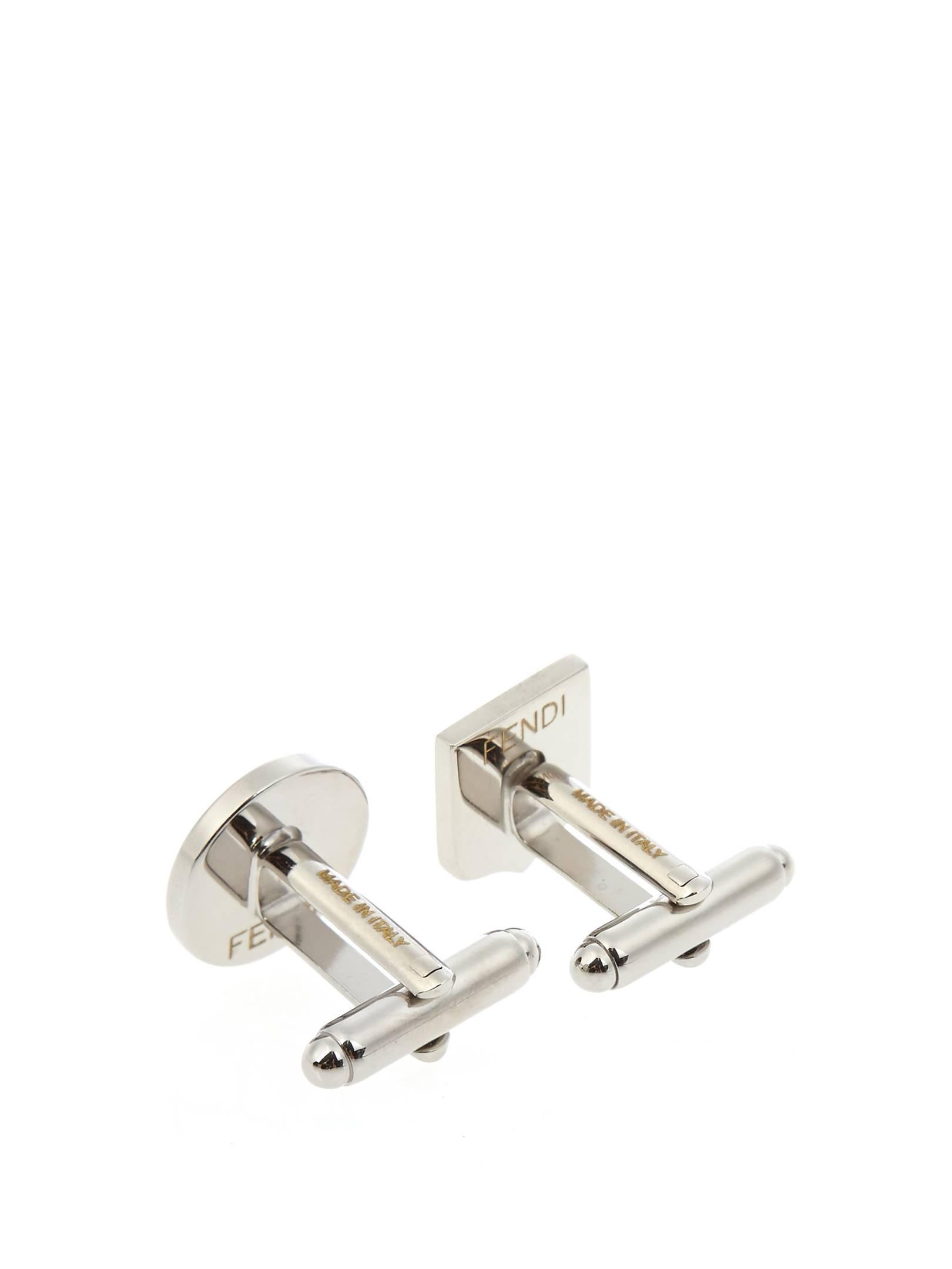 CURATOR'S NOTES

Fendi NEW Men's Silver Tone Palladium Emoji CuffLinks  

Brass
Silver tone 
Palladium finish
Swivel-back T-bar fastening
Made in Italy