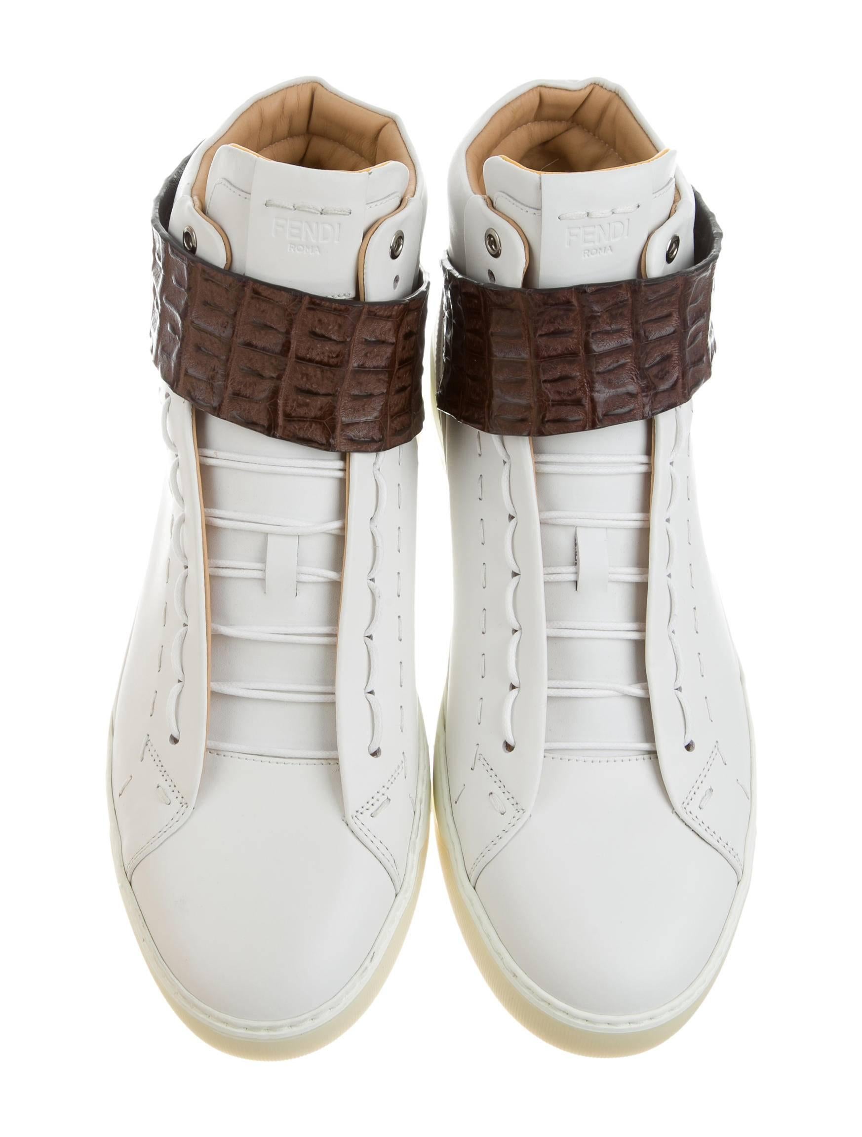 CURATOR'S NOTES

Fendi NEW Men's Limited Edition White Leather High Tops Sneakers Shoes in Box  

Size listed UK 11 (US 12)
Leather
Crocodile trim
Silver tone hardware
Rubber sole
Velcro and tie closure
Made in Italy
Heel height 1.25"
Includes