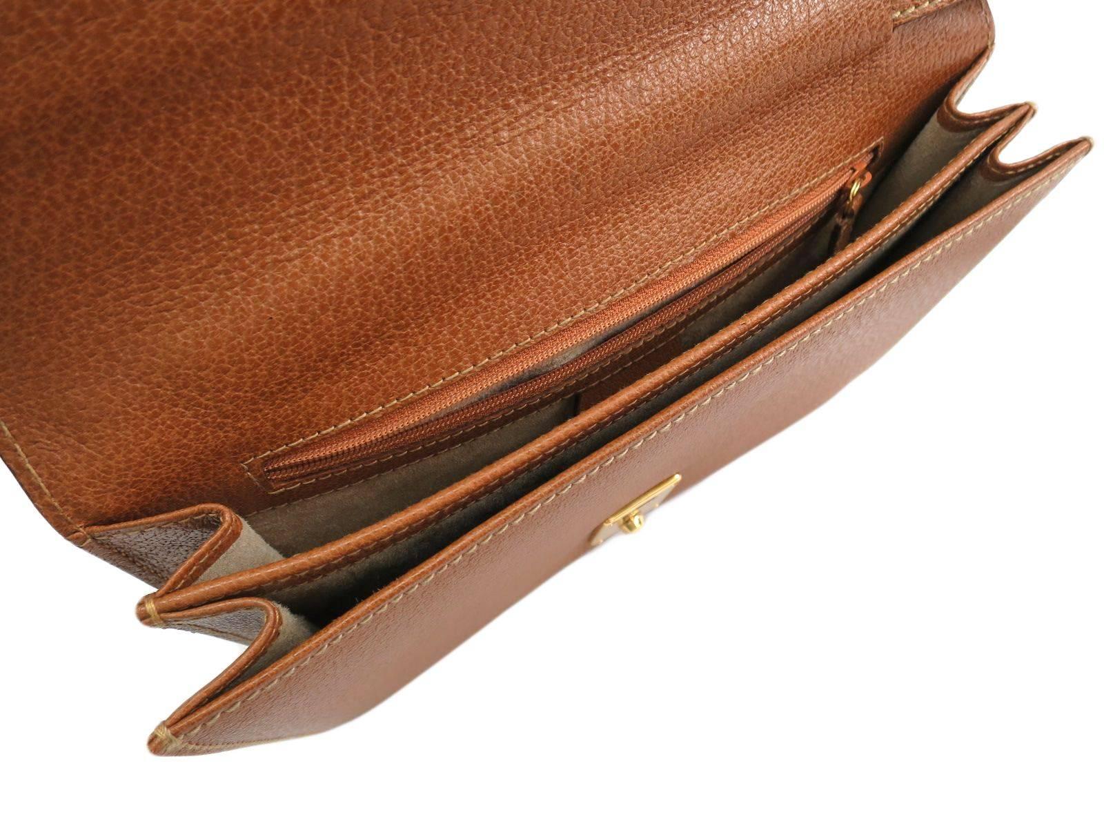 cognac clutch purse