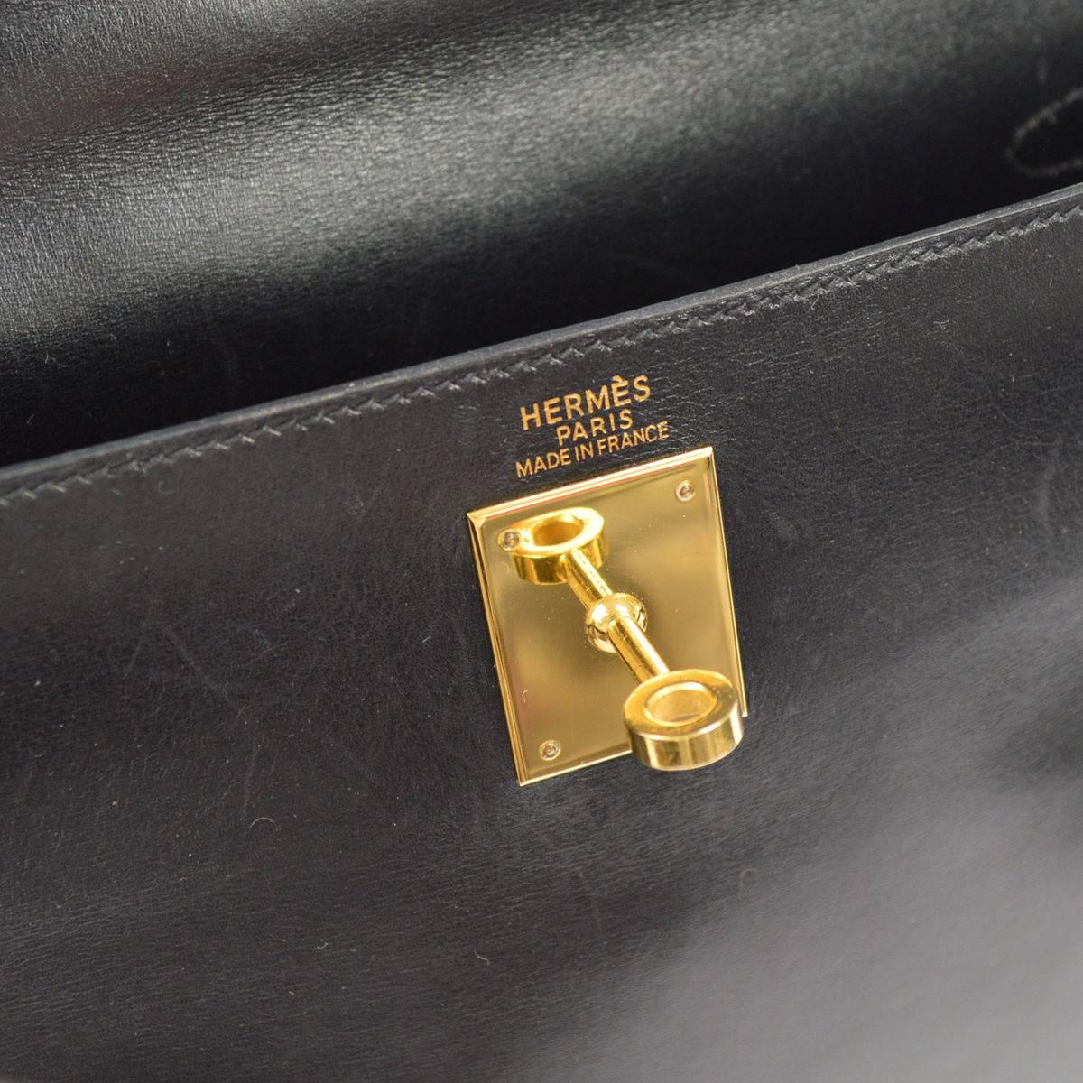 CURATOR'S NOTES

Hermes Vintage Black Leather Gold Kelly 32 Top Handle Satchel Bag in Dust Bag  

Calfskin leather
Gold tone hardware
Turnlock closure
Made in France
Date code Square B
Handle drop 4
