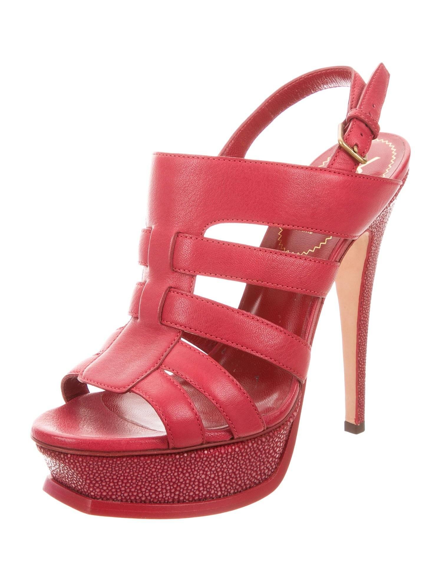 CURATOR'S NOTES

YSL New Red Leather Shark Leather Trim Evening Sandals Heels in Box  

Size IT 38
Leather
Shark trim
Gold tone hardware
Adjustable ankle buckle closure
Platform 1.50"
Heel height 5.75" 
Includes original YSL box