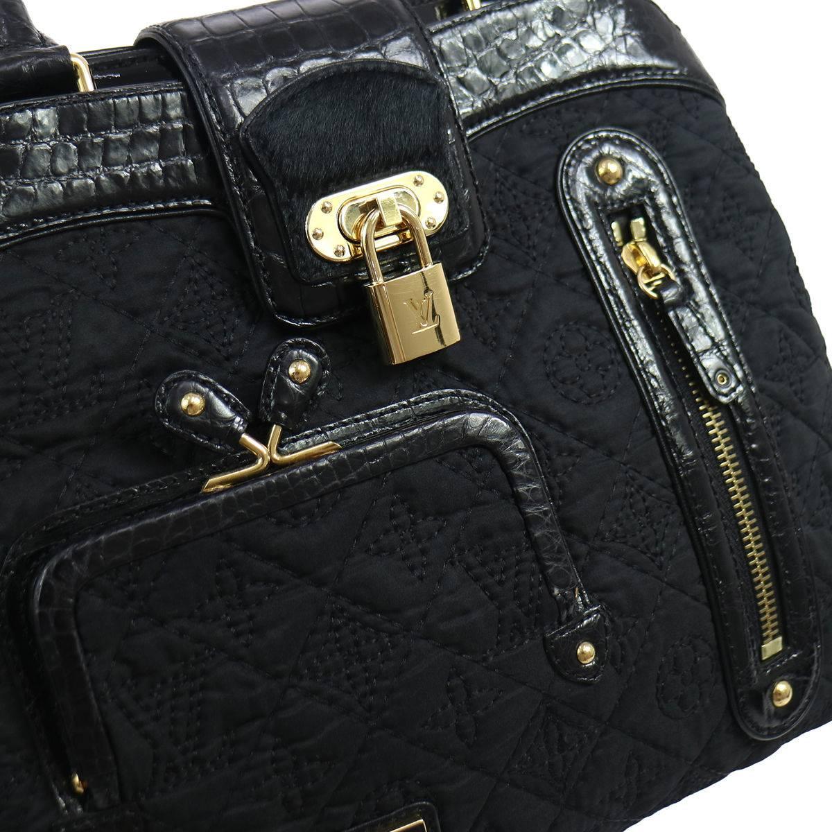 
Louis Vuitton Limited Edition Black Crocodile Leather Top Handle Satchel Evening Bag 
Leather (Crocodile)
Satin
Gold tone hardware
Leather liining
Zipper closure
Made in Italy
Date code RC0036
Handle drop 5