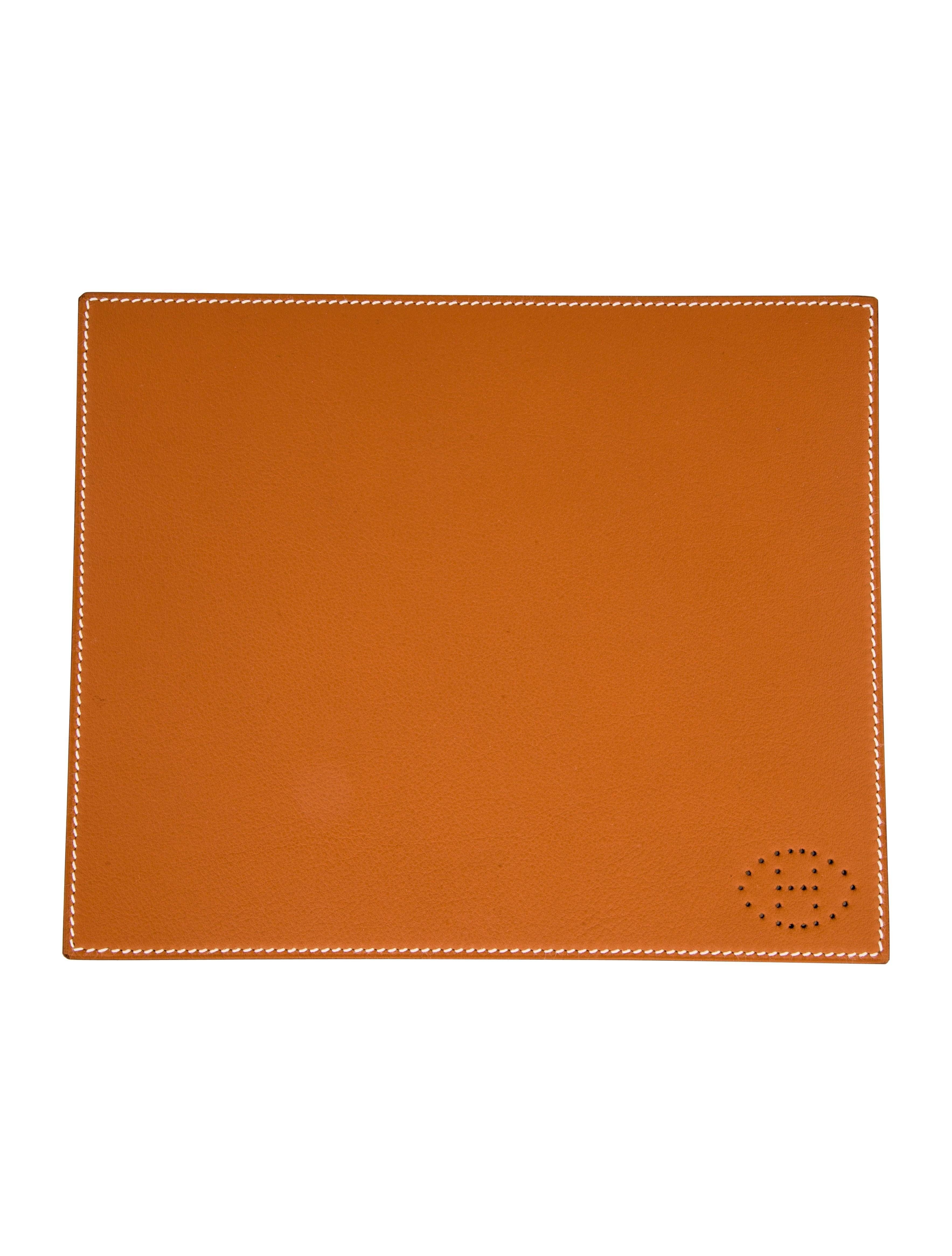 Hermes Cognac Brown Leather Men's Women's Miscellaneous GiftDesk Table Pad in Box 

Leather (Taurillon) 
Signed Hermes underneath
Made in France
Measures 7.25" W x 8.75" L
Includes original Hermes dust bag and box 