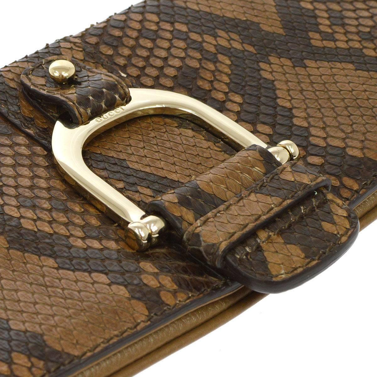 Gucci Cognac Taupe Black Snakeskin Leather Gold Horsebit Evening Clutch Bag  

Snakeskin
Leather
Gold tone hardware
Magnetic closure
Twill lining 
Made in Italy
Measures 12