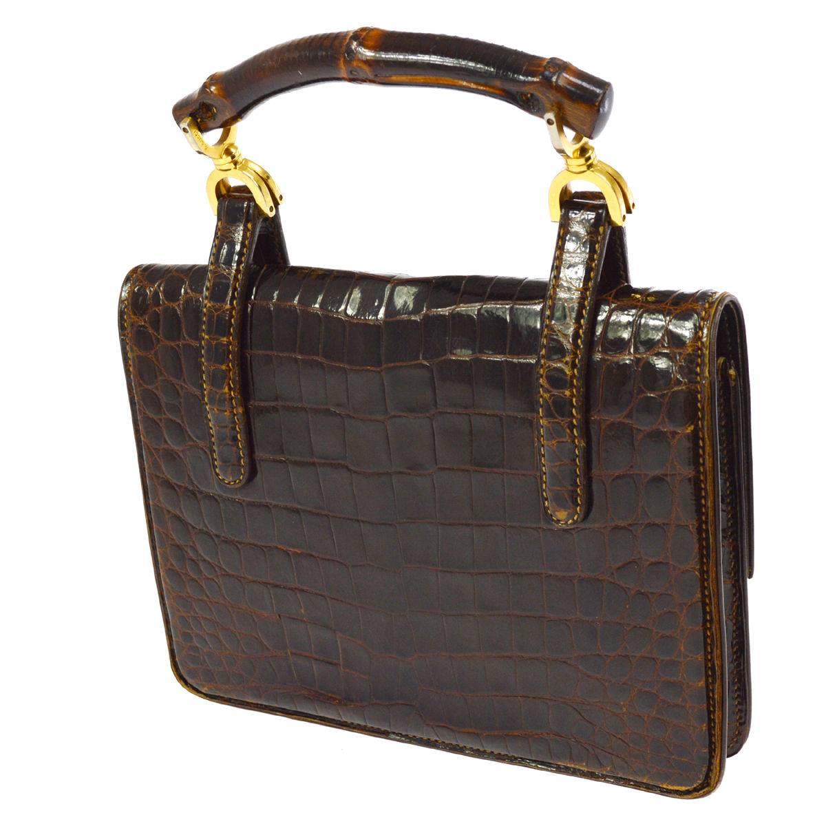 CURATOR'S NOTES

Gucci Vintage Cognac Bamboo Crocodile Evening Kelly Top Handle Satchel Flap Bag  

Crocodile
Bamboo
Gold tone hardware
Turnlock closure
Made in Italy
Handle drop 4"
Measures 9" W x 6.25" H x 3" D