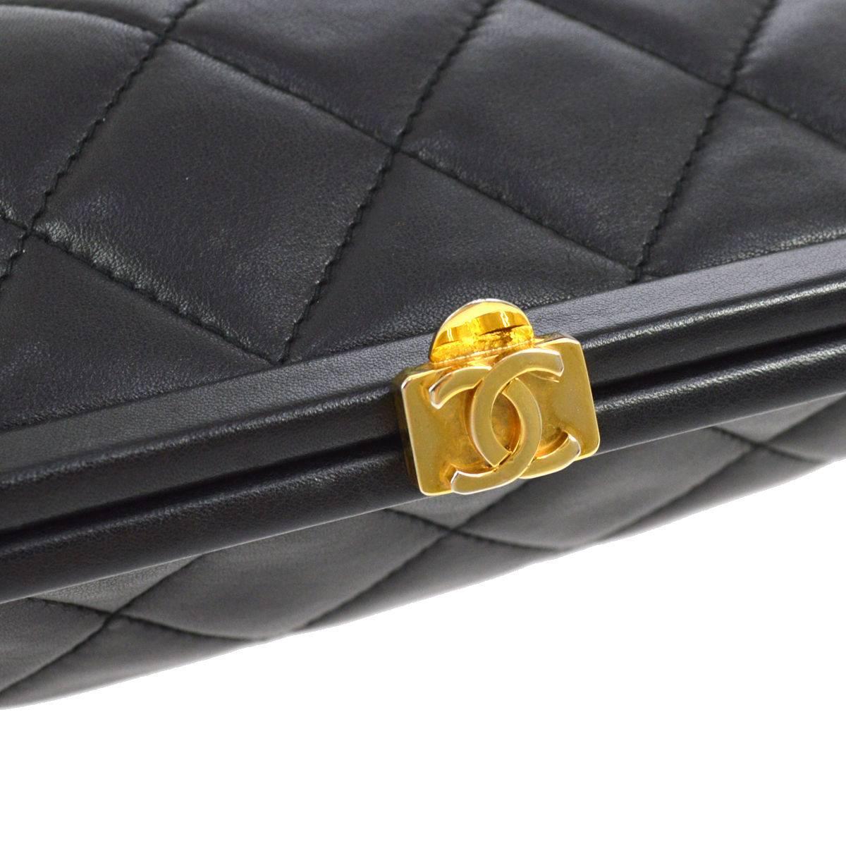 CURATOR'S NOTES

Chanel Black Quilted Lambskin Gold Charm Kisslock Evening Pouch Clutch Bag  

Lambskin leather
Gold tone hardware
Leather lining
Kisslock closure
Made in Italy
Date code 0275307
Measures 7.5" W x 5.5" H x 1.5" D