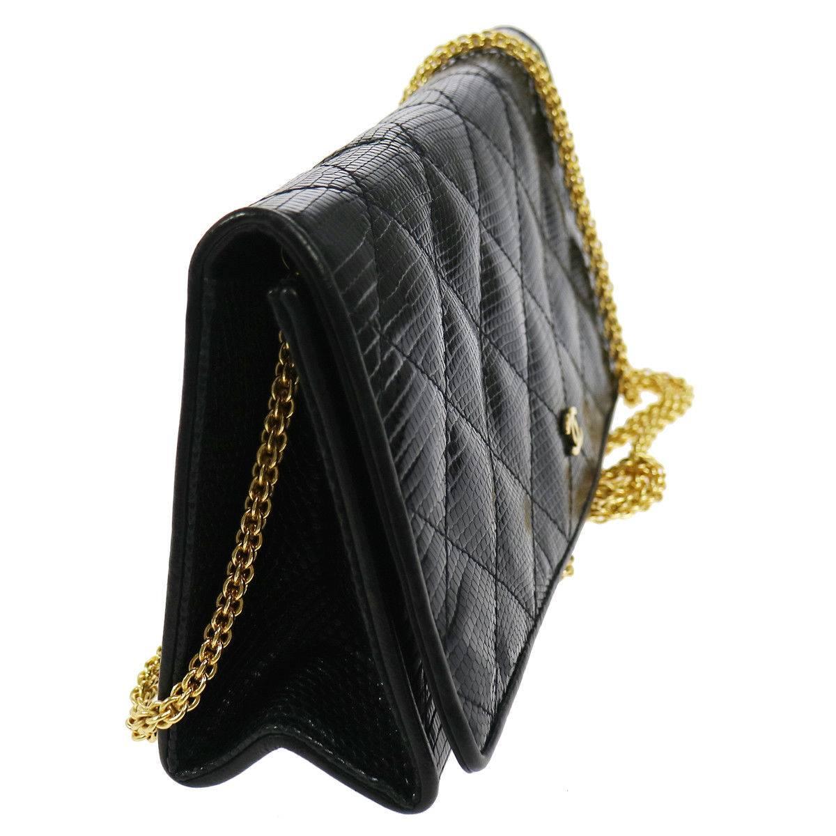 Chanel Black Lizard Leather Gold Chain 2 in 1 Clutch Flap Evening Shoulder Bag at Newfound Luxury 

Gold tone hardware
Snap button closure
Leather lining
Made in Italy
Chain strap drop 20"
Measures  9" W x 4" H x 2" D 