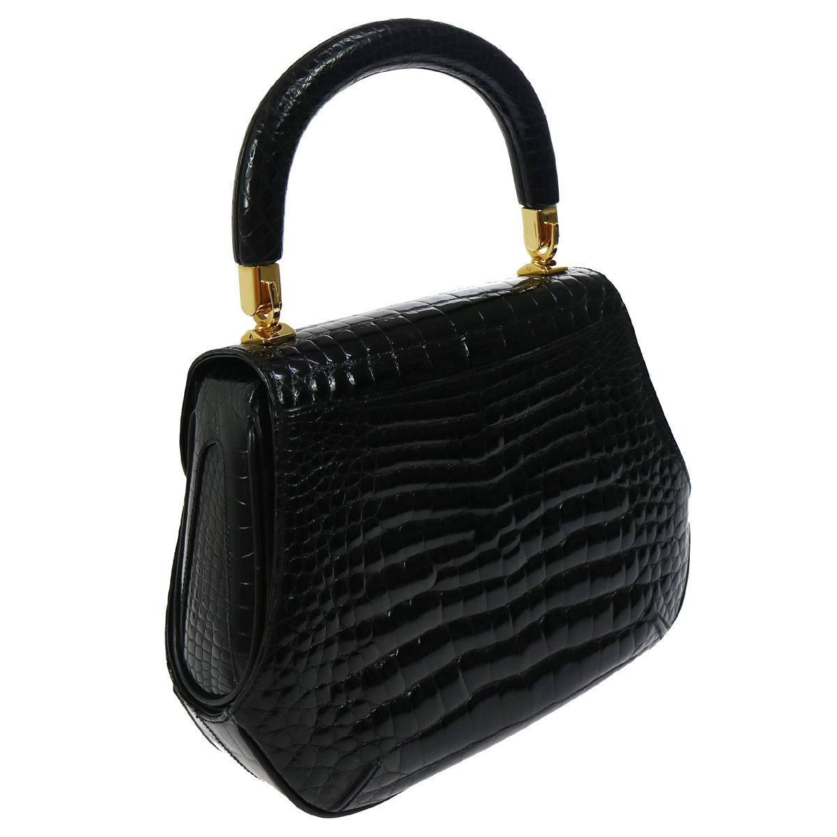 Gucci Black Crocodile Kelly Style Evening Top Handle Satchel Flap Bag in Box

Crocodile
Gold toe hardware
Leather lining
Made in Italy
Handle drop 5"
Measures 10" W x 8" H x 3.5" D 
Includes original Gucci dust bag and box
