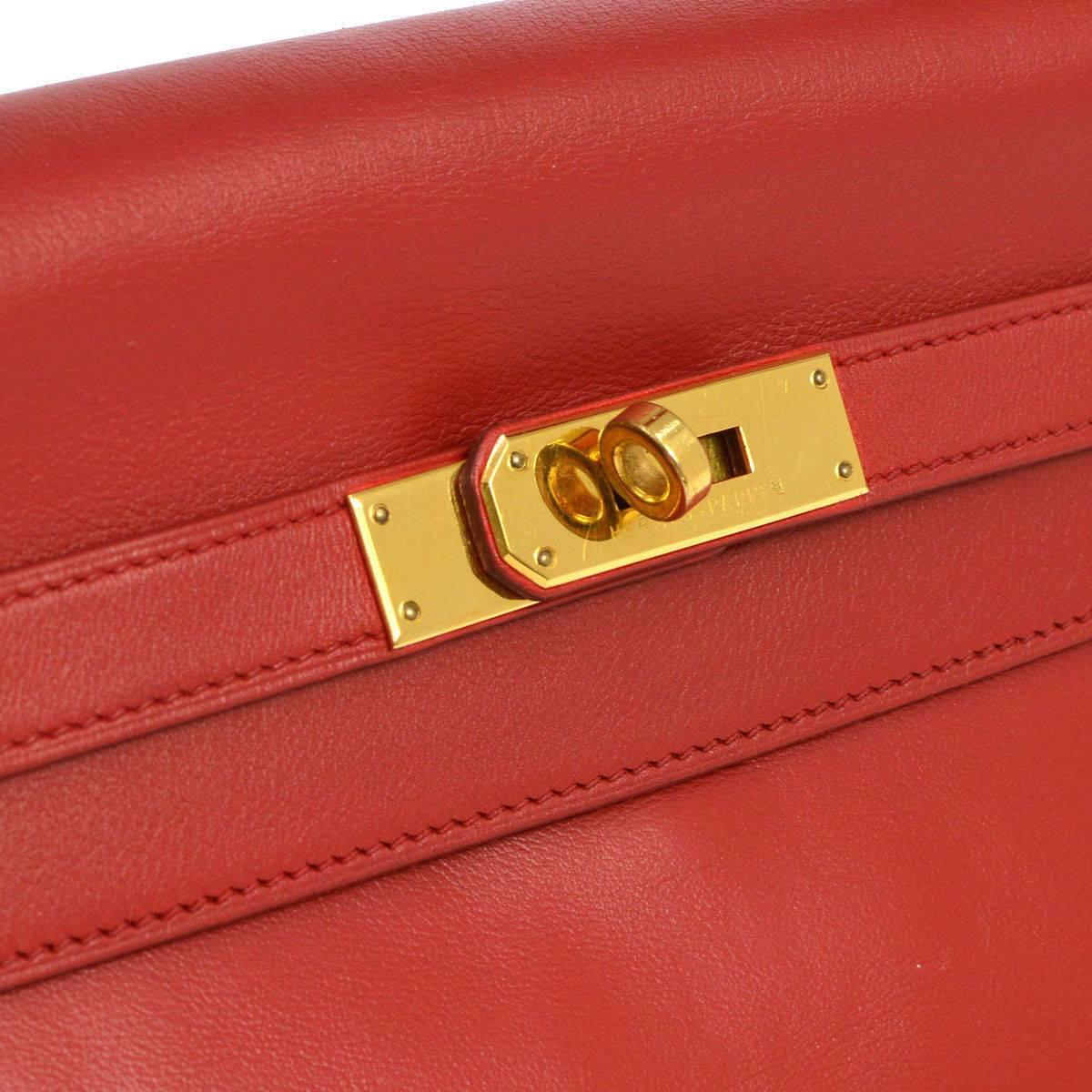 Hermes Kelly 32 Rouge Red Leather Evening Top Handle Satchel Flap Bag in Box 

Box calf leather
Gold tone hardware
Leather lining
Date code Circle Z
Made in France
Handle drop 5"
Removable shoulder strap drop 18"
Measures 12.5" W x