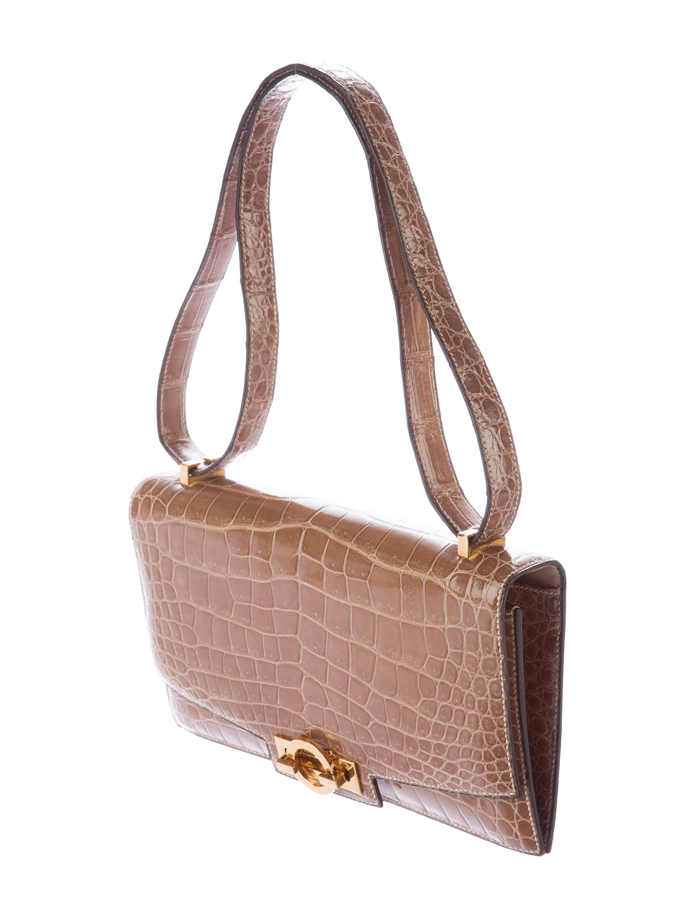 Hermes Cognac Taupe Crocodile Exotic Evening Kelly Style Top Handle Satchel Shoulder Flap Bag 

Crocodile 
Gold tone hardware
Leather lining,
Turn-lock closure 
Date code present
Made in France
Shoulder strap drop 14