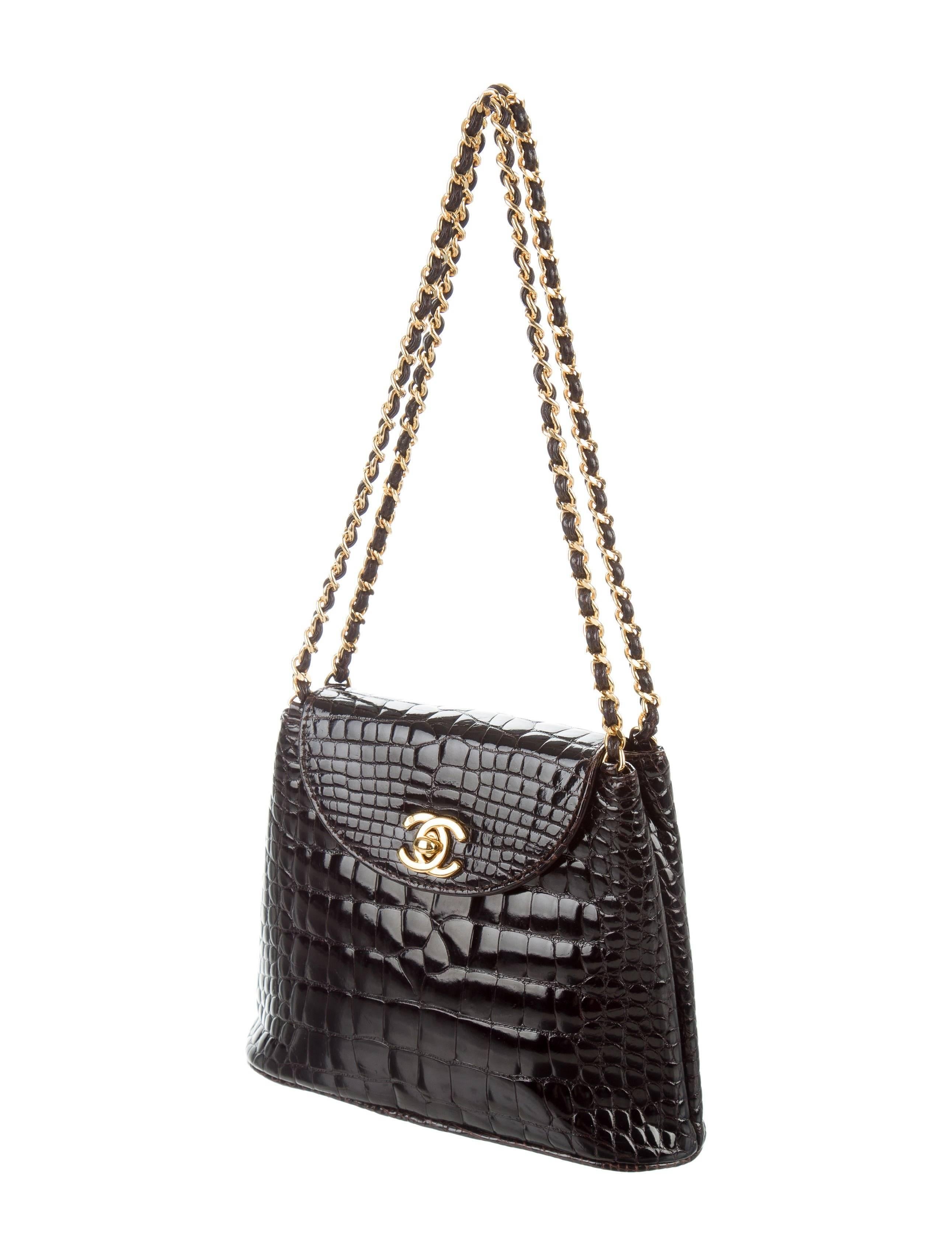 CURATOR'S NOTES

Chanel Dark Chocolate Crocodile CC Clutch Evening Satchel Flap Bag W/Accessories  

Crocodile 
Gold tone hardware
Leather lining
Turn lock closure 
Date code present 
Includes original Chanel authenticity card and dust bag
Shoulder