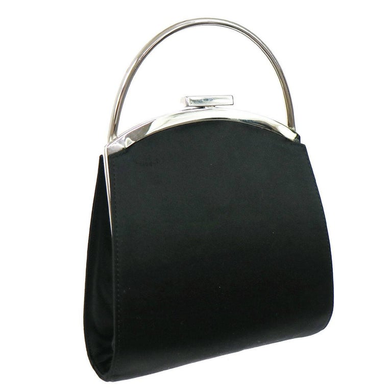 CURATOR'S NOTES


Gucci Black Satin Silver Top Handle Kelly Style Kisslock Evening Top Handle Bag 

Satin
Metal
Silver tone hardware
Satin lining
Date code present 
Made in Italy
Handle drop 2"
Measures 6.25" W x 6.75" Hx 1.25" D