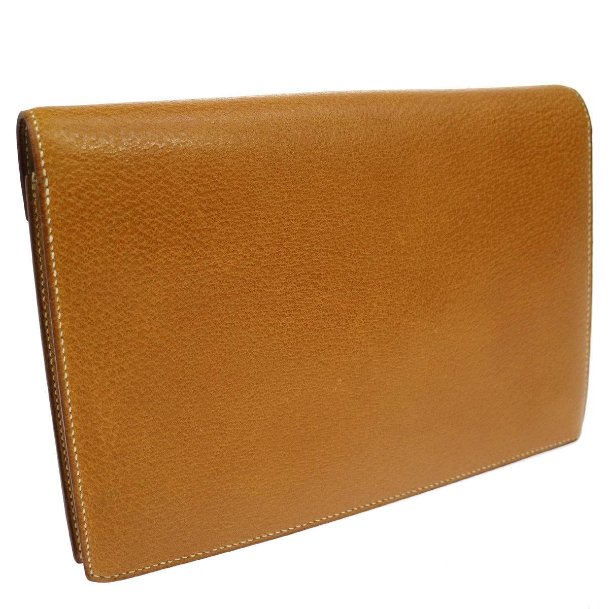 CURATOR'S NOTES

Hermes Cognac Colorblock Leather Envelope Evening Clutch Bag

Leather
Gold tone hardware
Leather lining
Made in France
Date code Circle X
Measures 9" W x 6.25" H x 2" D
Includes original Hermes dust bag