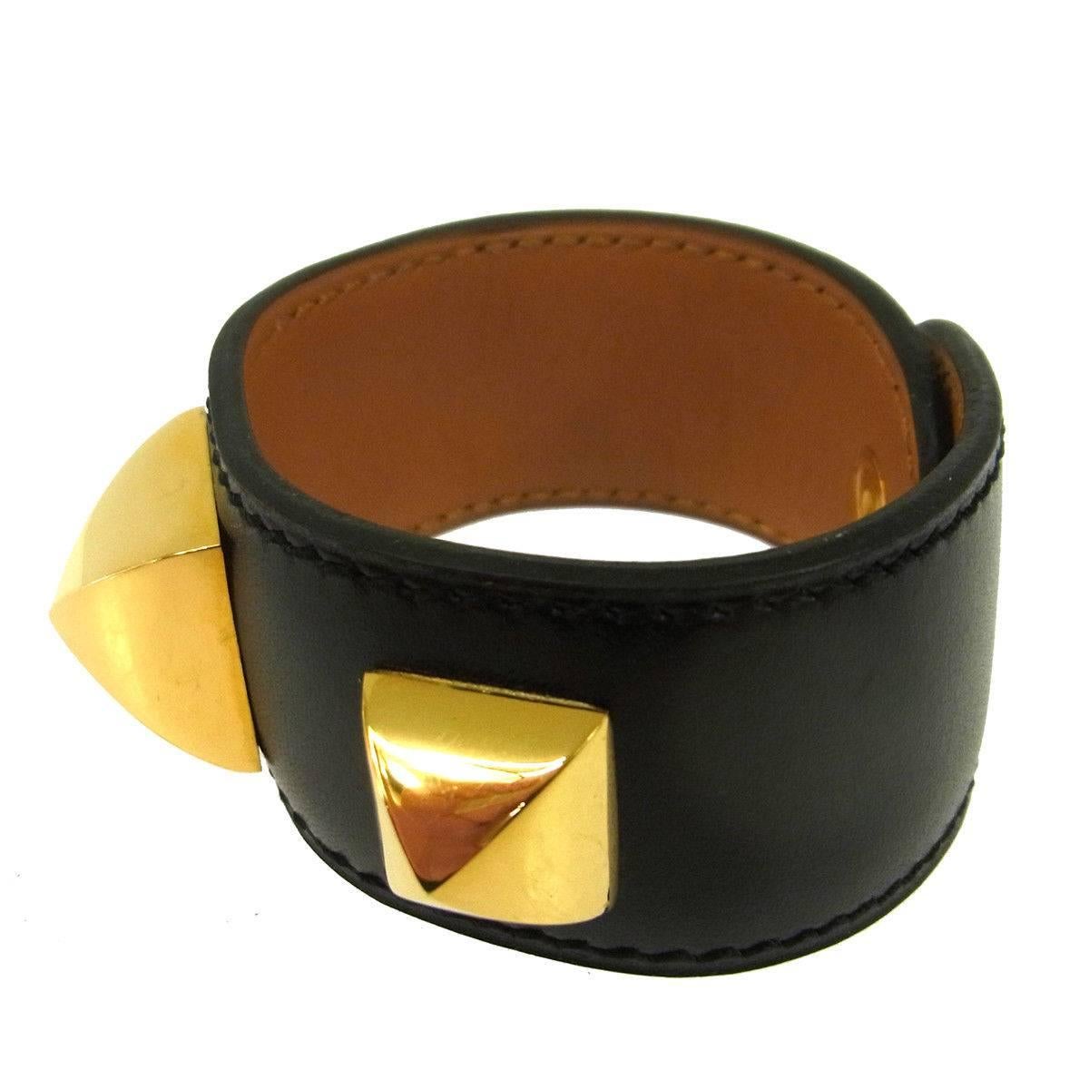 CURATOR'S NOTES

Hermes Black Leather Gold Stud Evening Men's Women's Cuff Bracelet in Box

Leather
Metal
Gold tone hardware
Made in France
Width 1"
Inner circumference ~6"
Includes original Hermes box
