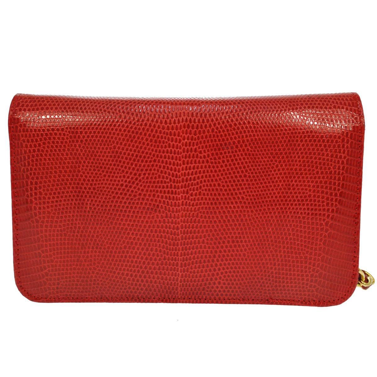 Chanel Red Lizard Gold WOC Wallet on Chain Clutch Evening Flap Shoulder Bag

Lizard
Gold tone hardware
Leather lining
Date code present
Made in France
Shoulder strap drop 17"
Measures 7.5" W × 4.5" H x 2.5" D  