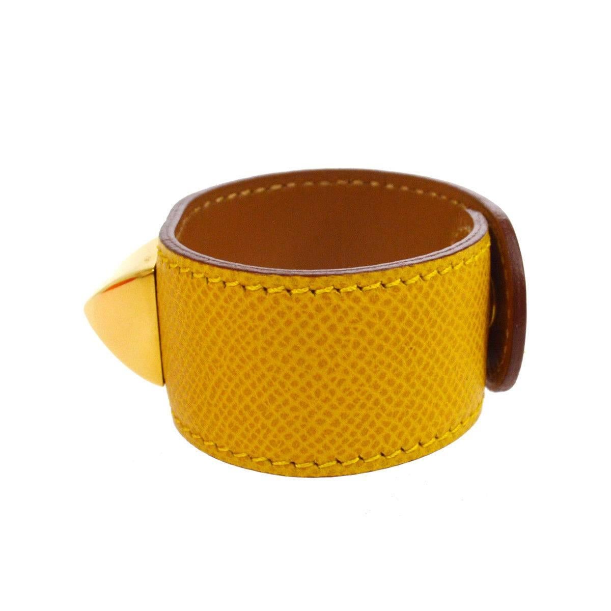 Hermes Mustard Leather Gold Stud Men's Women's Evening Cuff Bracelet in Box

Leather
Metal
Gold tone hardware
Snap closure
Made in France
Width 1