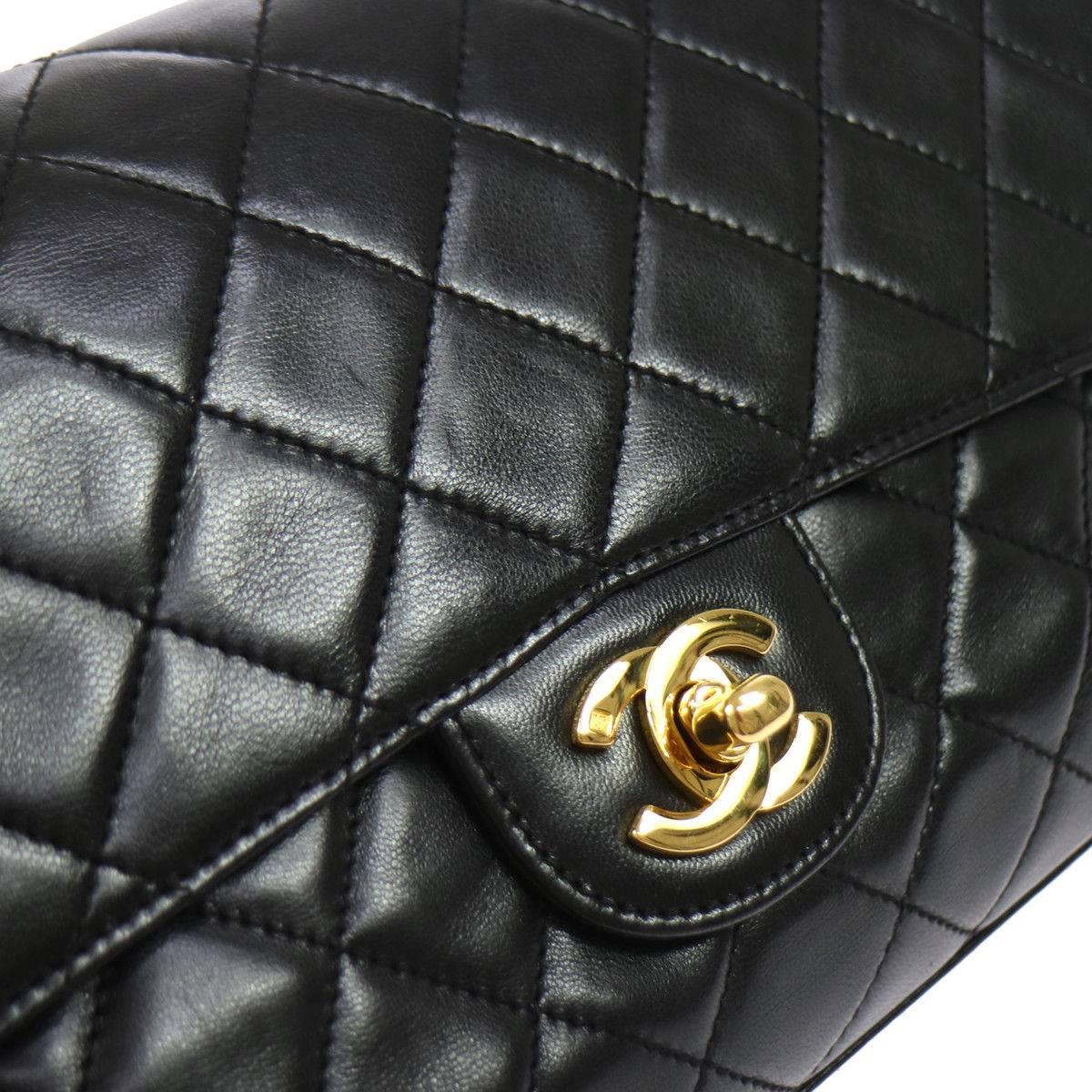 CURATOR'S NOTES

Chanel Black Lambskin Gold Top Handle Envelope Evening Clutch Flap Bag

Lambskin
Gold tone hardware
Leather lining
Date code present
Made in France
Measures 10.25" W x 6.25" H x 2.5" D 