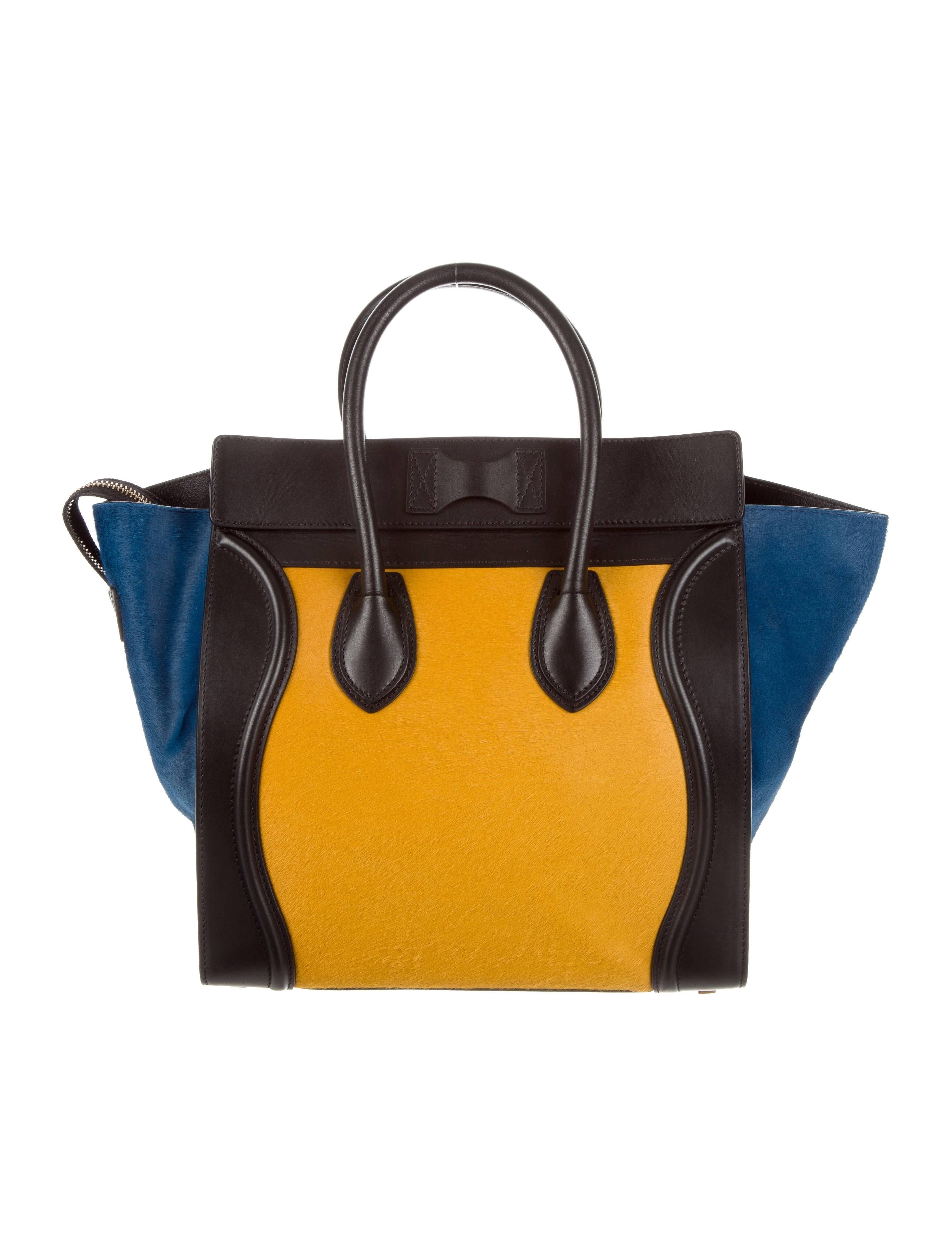 CURATOR'S NOTES

Celine NEW Black Blue Yellow Pony Small Mini Top Handle Satchel Tote Bag

Ponyhair 
Gold tone hardware
Leather lining
Zip closure 
Handle Drop 5