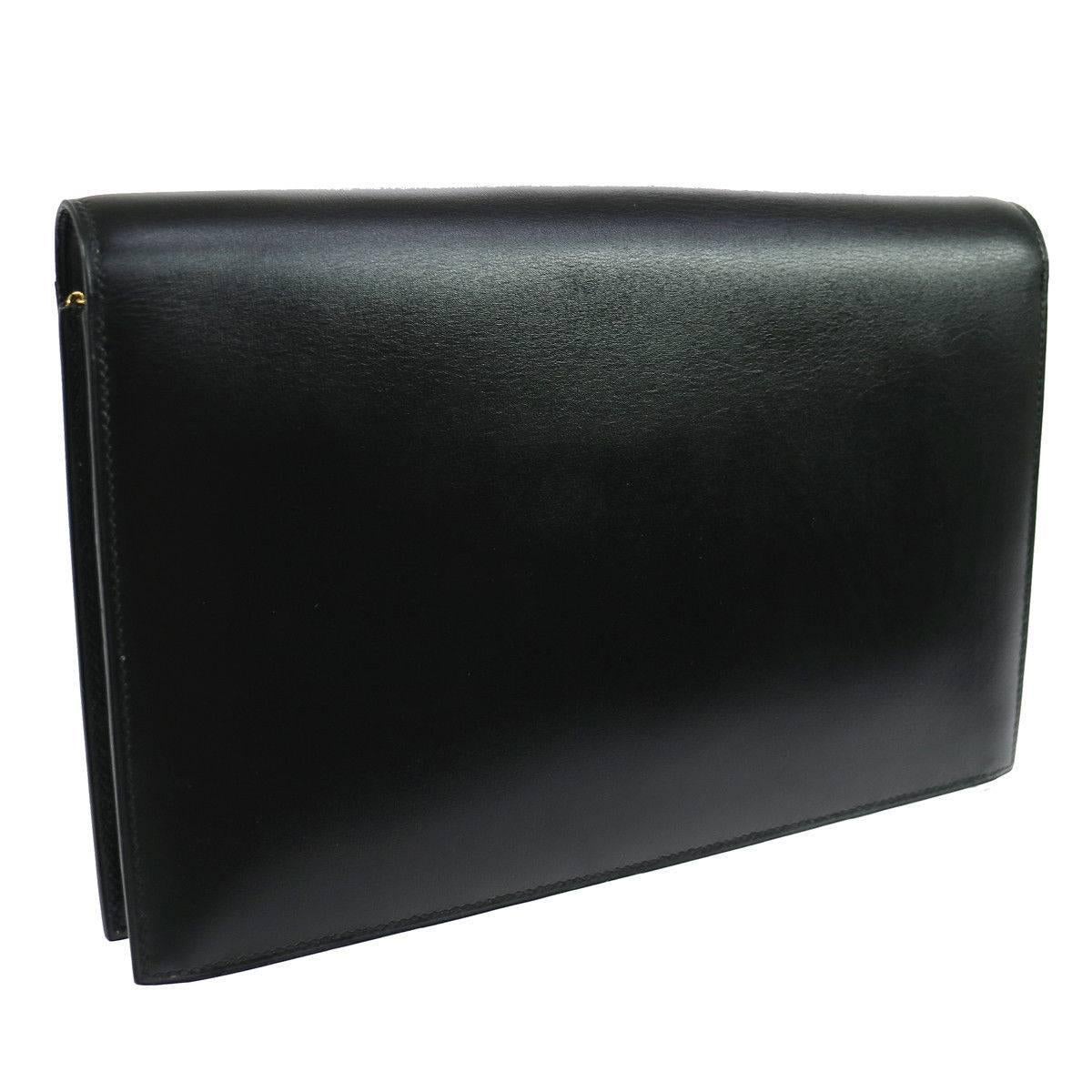 CURATOR'S NOTES

Hermes Black Leather Gold H Lock Charm Top Handle Envelope Evening Clutch Flap Bag

Leather
Gold tone hardware
Leather lining
Snap closure
Made in France
Date code Circle U
Measures 10.25