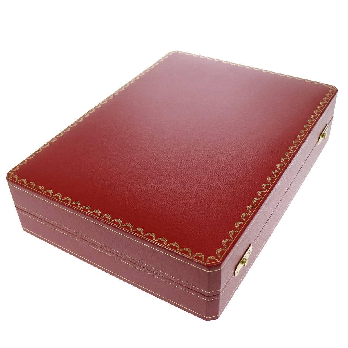 A wonderful gift idea! Cartier Red Leather Men's Women's Travel Storage Vanity Watch Case Trunk in Box

Leather
Gold tone hardware
Push lock closures
Woven lining
Measures 15.75" W x 3.5" H x 11.5" D
Includes removable inserts as