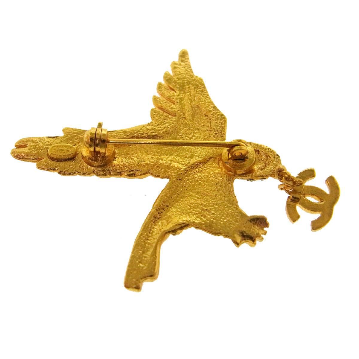 Chanel Rare Gold Crystal Studded Bird Charm Evening Pin Lapel Brooch in Box

Metal
Gold tone hardware
Crystal
Pin closure
Made in France
Measures 2" W x 2" H 
Includes original Chanel box