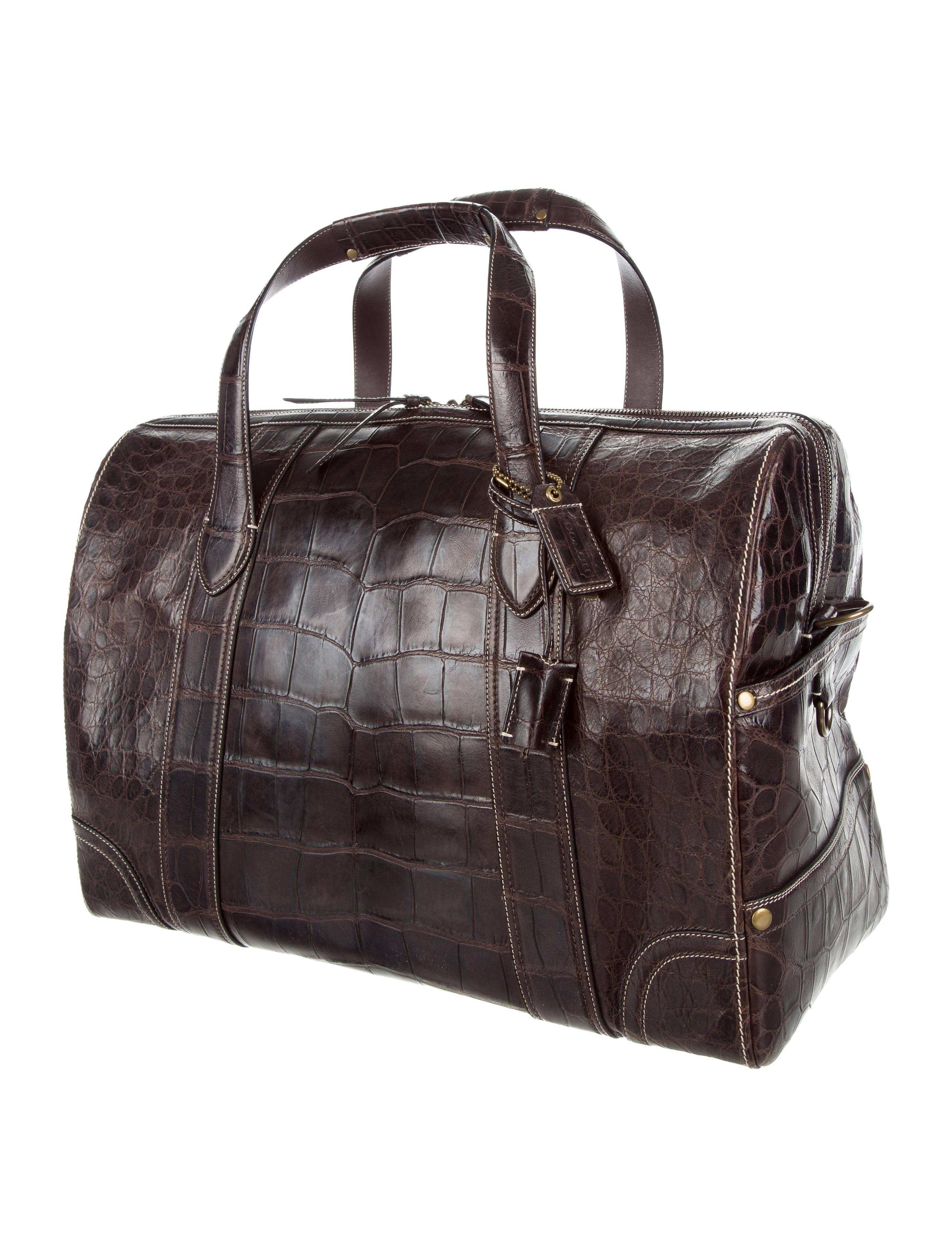 Coach Crocodile Chocolate Brown Men's Carryall Weekender Travel Tote Duffle Bag

Original purchase price $24,995
Crocodile 
Brass hardware
Woven lining
Zipper closure
Removable shoulder strap 21