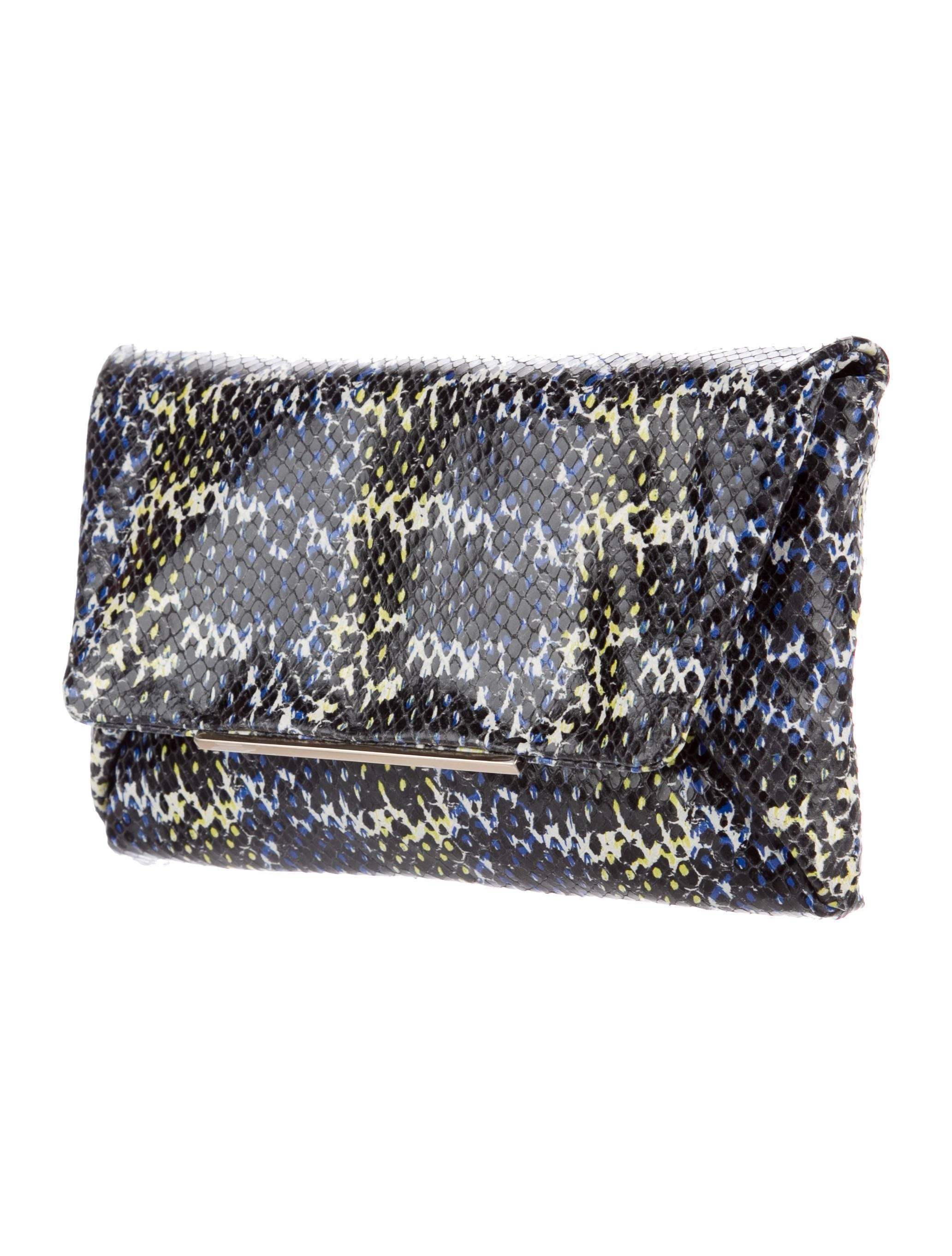 CURATOR'S NOTES

Lanvin New Multi Color Leather Envelope 2 in 1 Evening Clutch Shoulder Flap Bag

Leather 
Gold tone hardware
Woven lining
Magnetic closure 
Removable chain shoulder strap drop 19