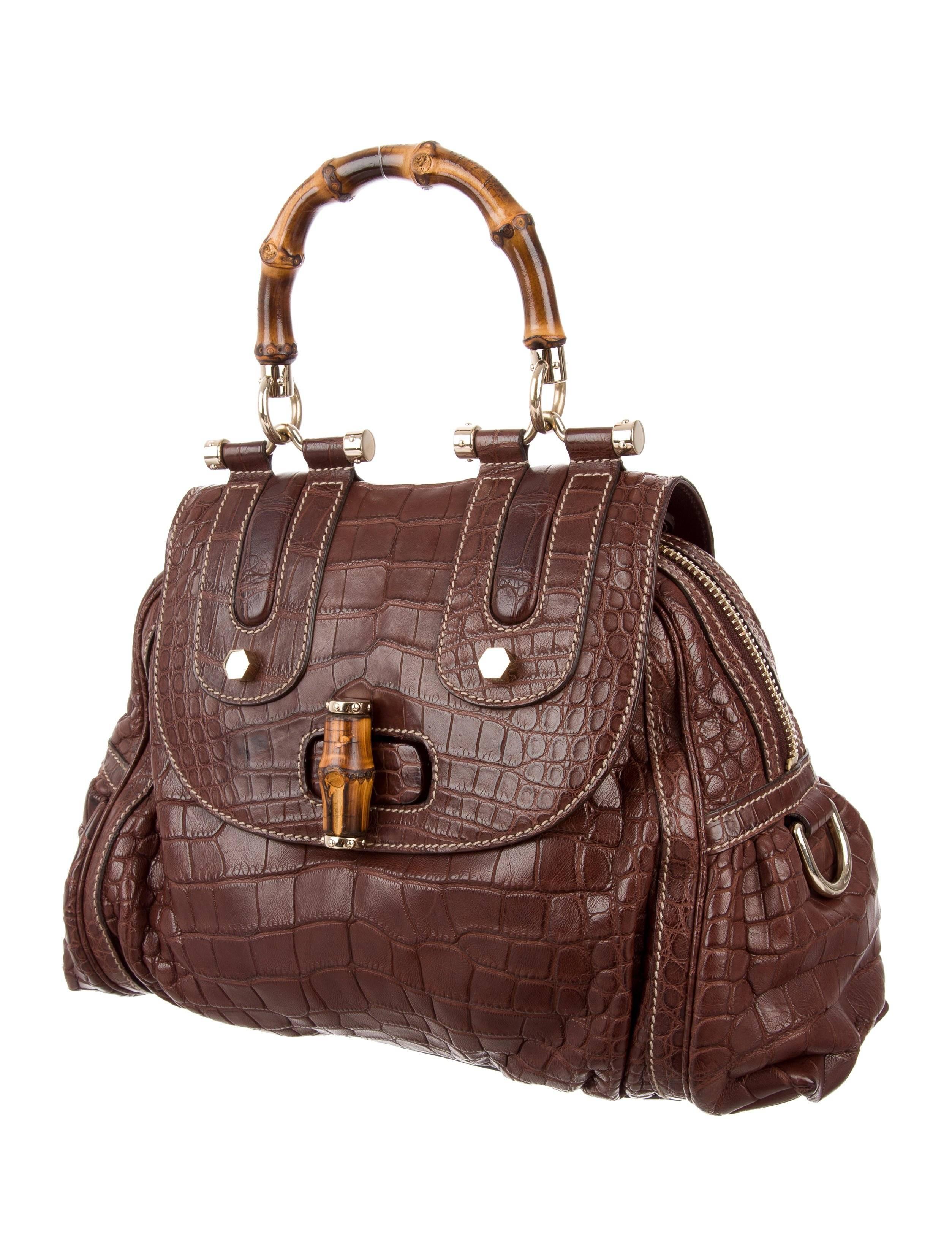 Gucci New Chocolate Crocodile Exotic Skin Kelly Bamboo Top Handle Satchel Bag

Crocodile
Bamboo
Gold tone hardware
Leather lining 
optional shoulder strap
Turn lock closure
Made in Italy
Handle drop 5"
Removable shoulder strap 12"
Measures
