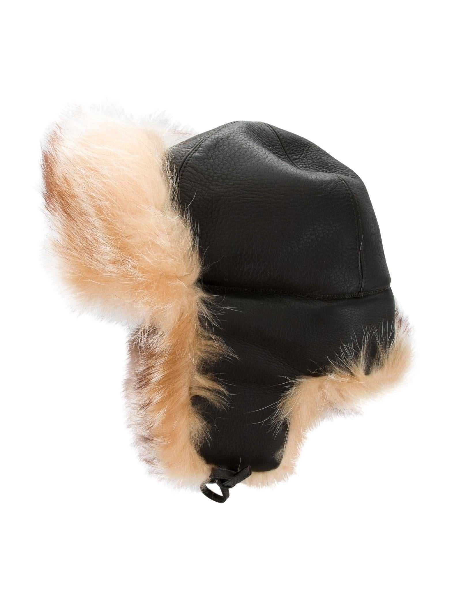Hermes New Leather Cognac Fur Russian Style Men's Women's Winter Flap Hat in Box

Leather
Raccoon fur 
Woven lining 
Tie straps at side flaps
Made in France
Brim measures 3