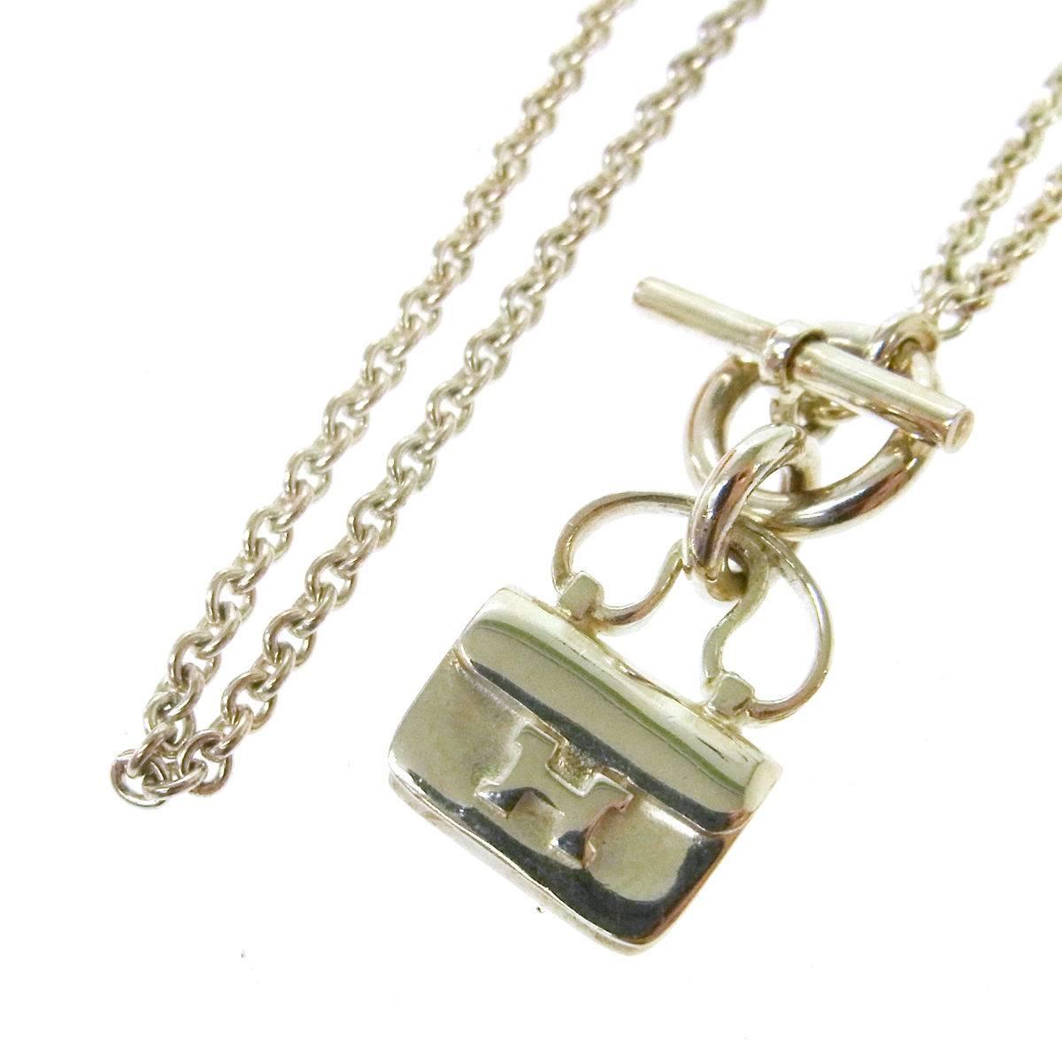 Hermes Genuine Sterling Silver H Handbag Charm Toggle Chain Necklace in Box

Sterling silver - 925
Toggle closure
Made in France
Charm diameter 0.5" 
Total length 15.75"
Includes original Hermes box