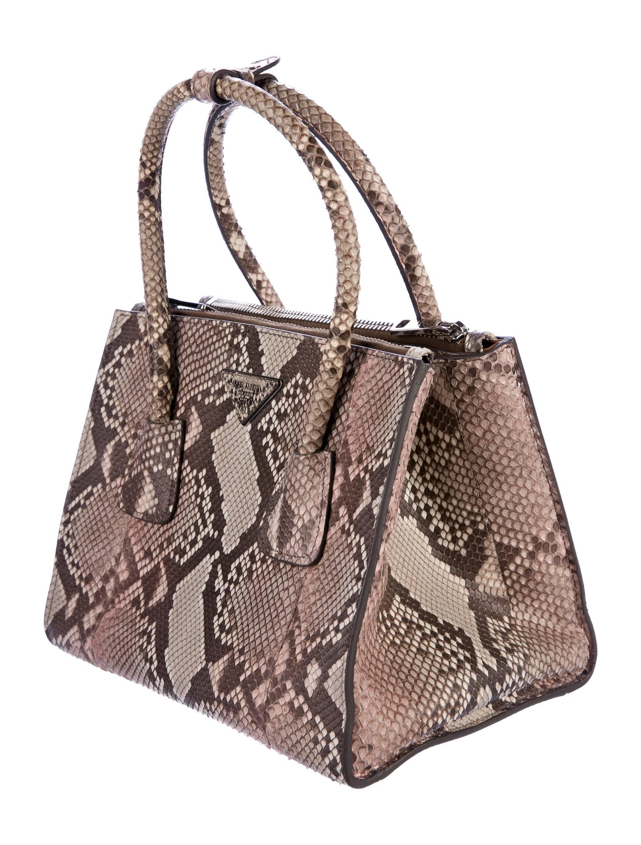 Prada NEW Multi Color Snakeskin Top Handle Kelly Style Satchel Shoulder Bag

Snakeskin (Python)
Silver tone hardware
Leather lining
Magnetic closure
Handle drop 4"
Measures 16" W x 10" H x 8" D 
Includes original detachable