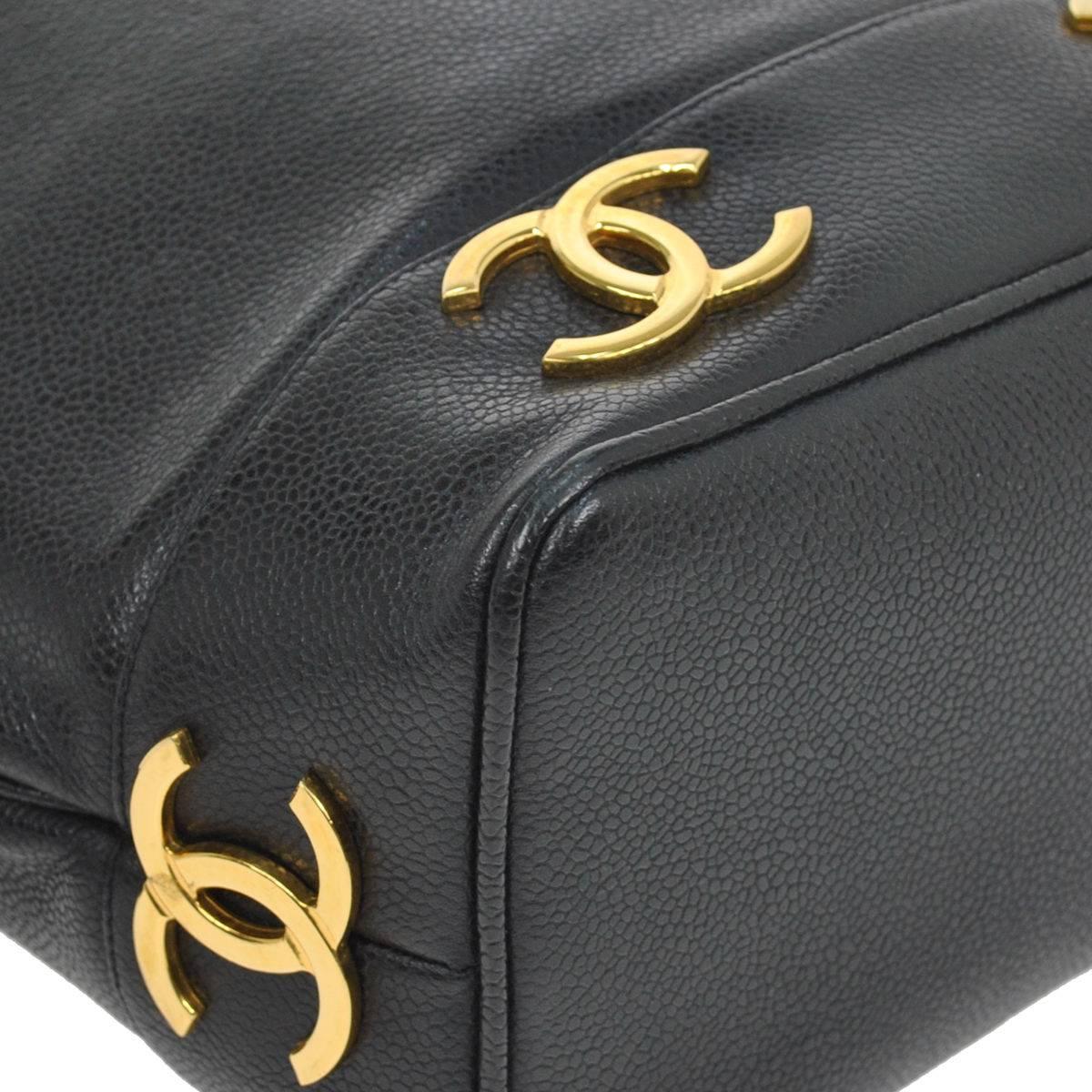 Chanel Black Leather Gold Charms Sling Back Carryall Duffle Shoulder Bag In Good Condition In Chicago, IL