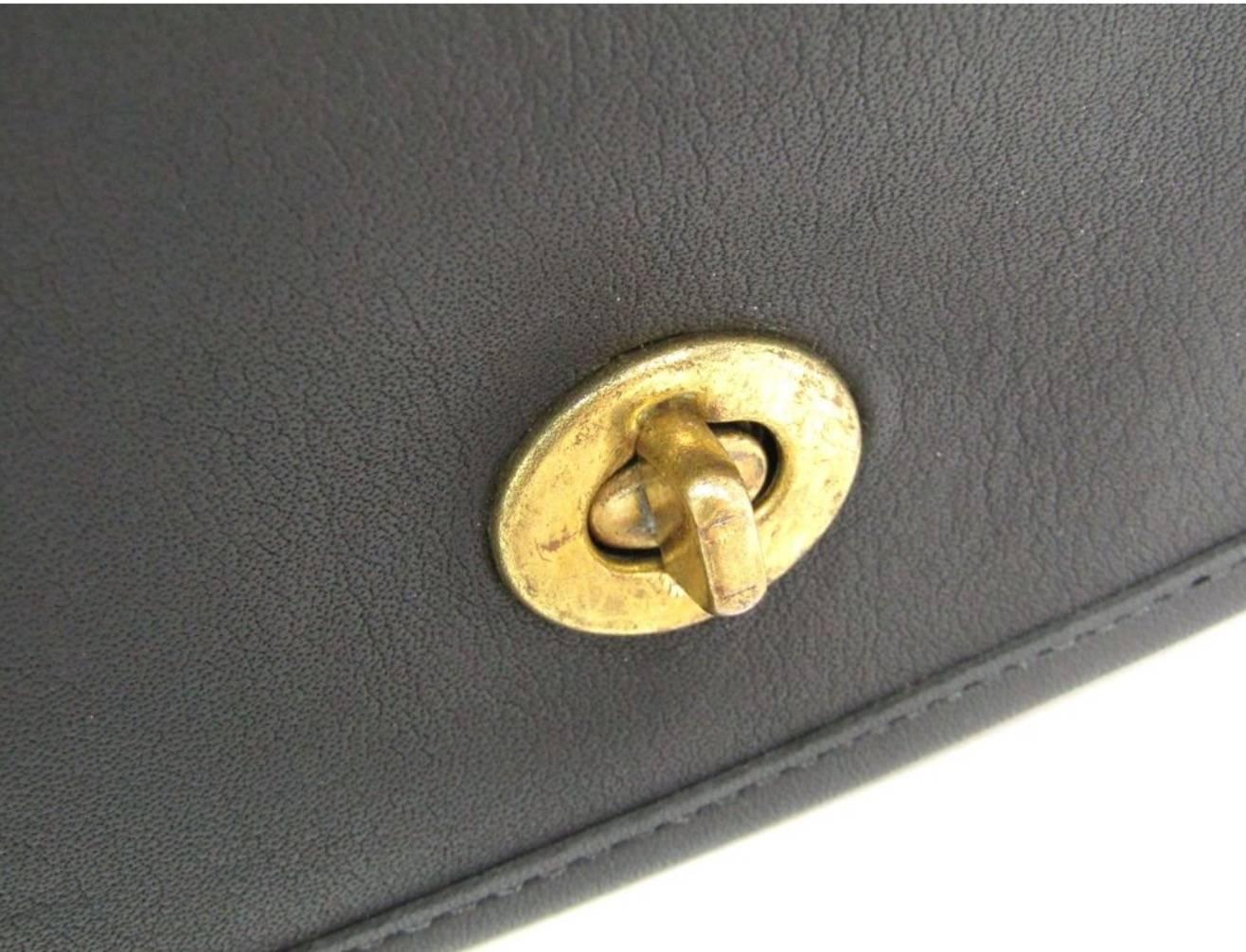 Coach Vintage Archive Black Leather Saddle Crossbody Shoulder Flap Bag

Leather
Gold tone hardware
Turnlock closure
Made in United States
Adjustable shoulder strap drop 39-42.5"
Measures 11" W x 8.75" H x 4" D 
Includes original