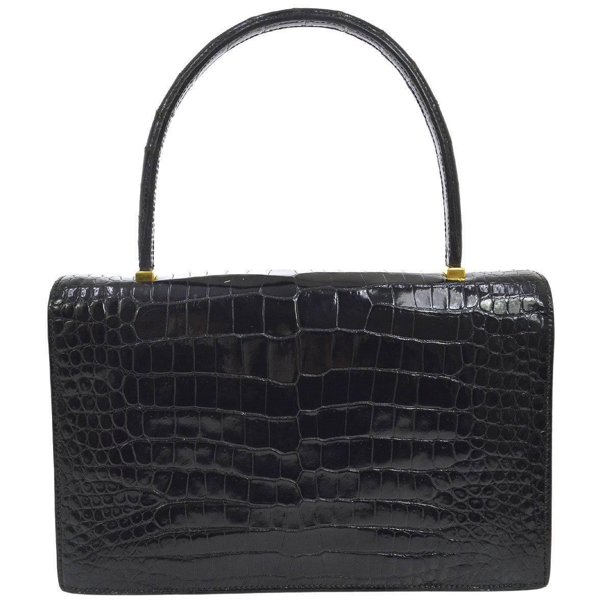 Hermes Rare Black Crocodile Exotic Leather Gold Emblem Evening Kelly Style Top Handle Satchel Bag

Crocodile leather
Gold tone hardware
Leather lining
Made in France
Handle drop 4.5