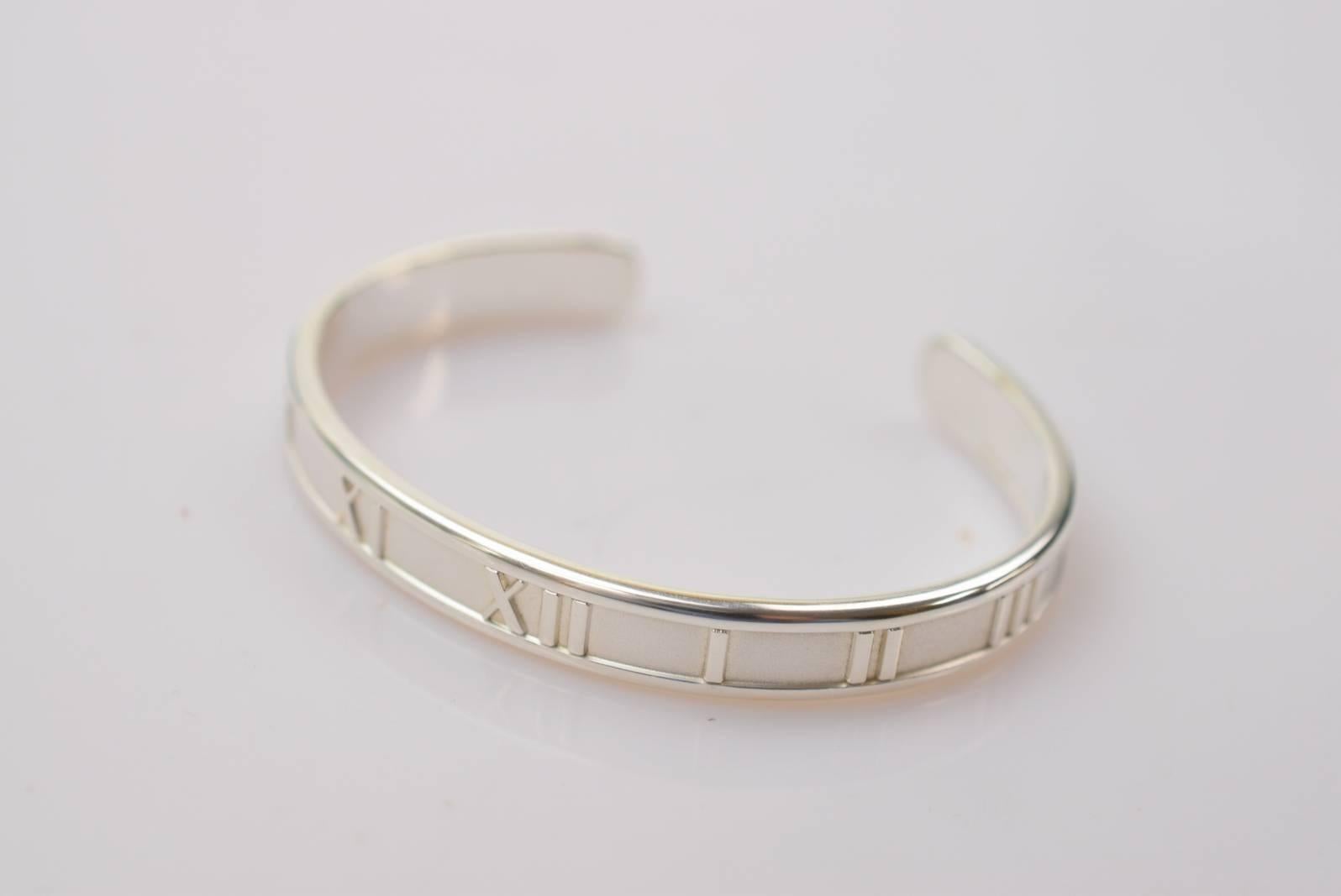 Tiffany & Co. Sterling Silver Roman Numerals Atlas Cuff Bangle Bracelet in Box

Sterling silver - 925
Slip on
Made in Italy
Inner circumference ~6