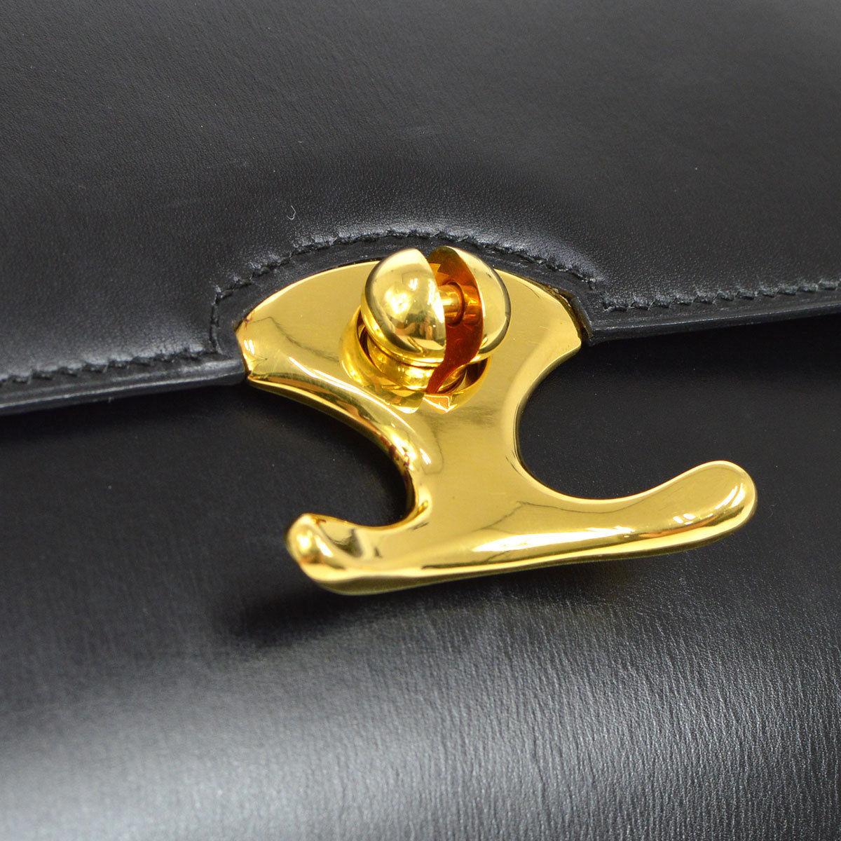 Hermes Black Leather Gold Emblem Evening Top Handle Satchel Kelly Style Bag

Leather
Gold tone hardware
Leather lining
Date code present
Made in France
Adjustable shoulder strap 8-17