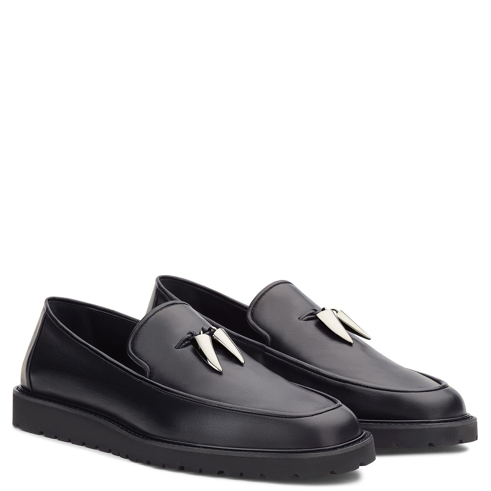 Giuseppe Zanotti New Black Leather Silver Tooth Men's Loafers Shoes in Box

Size IT 45
Leather
Ruthenium metal
Leather and rubber sole
Made in Italy
Includes original Giuseppe Zanotti dust bag and box
