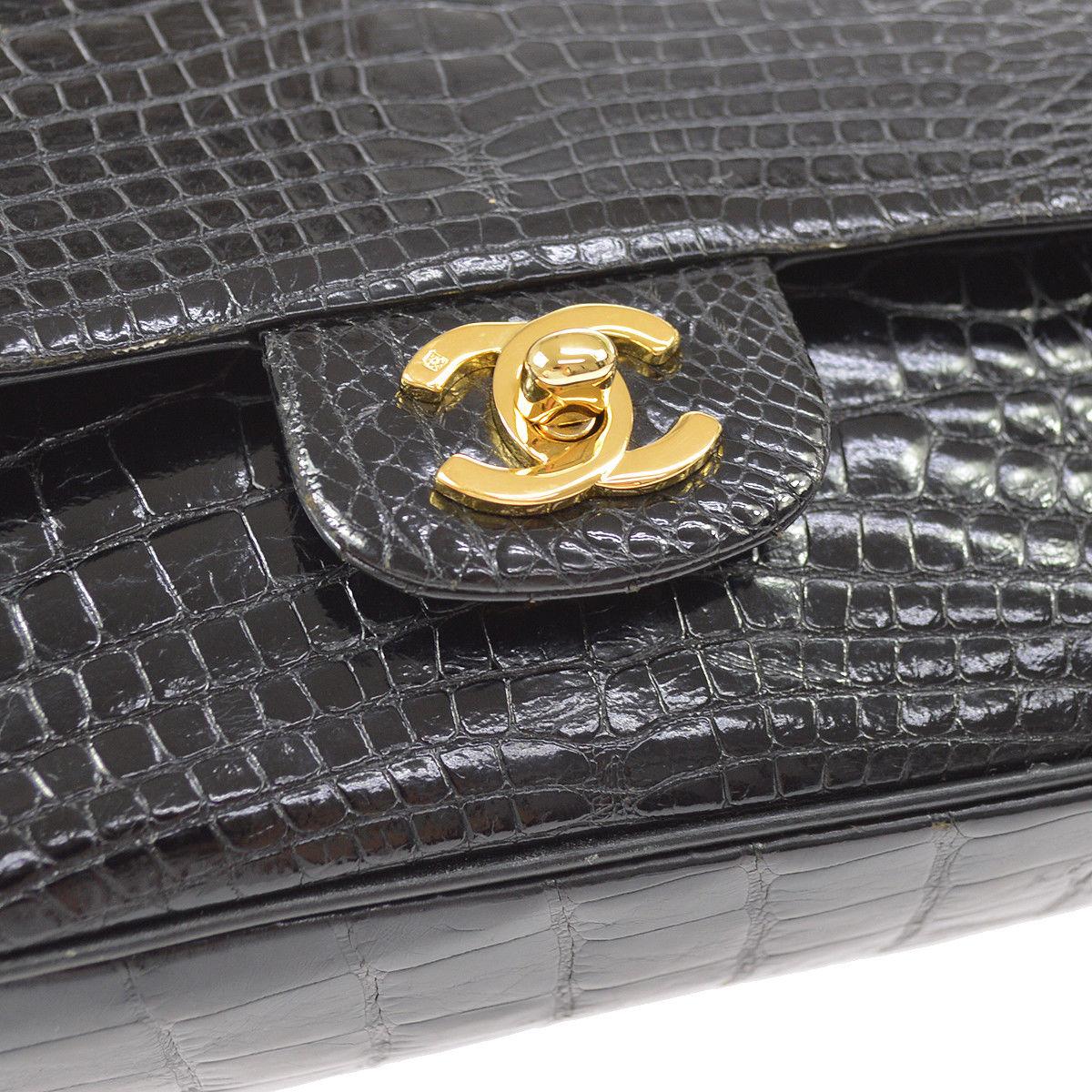 Chanel Black Crocodile Leather Gold Turnlock Evening Clutch Flap Shoulder Bag

Crocodile
Gold tone hardware
Leather lining
Turnlock closure
Date code present 
Made in France
Shoulder strap drop 17