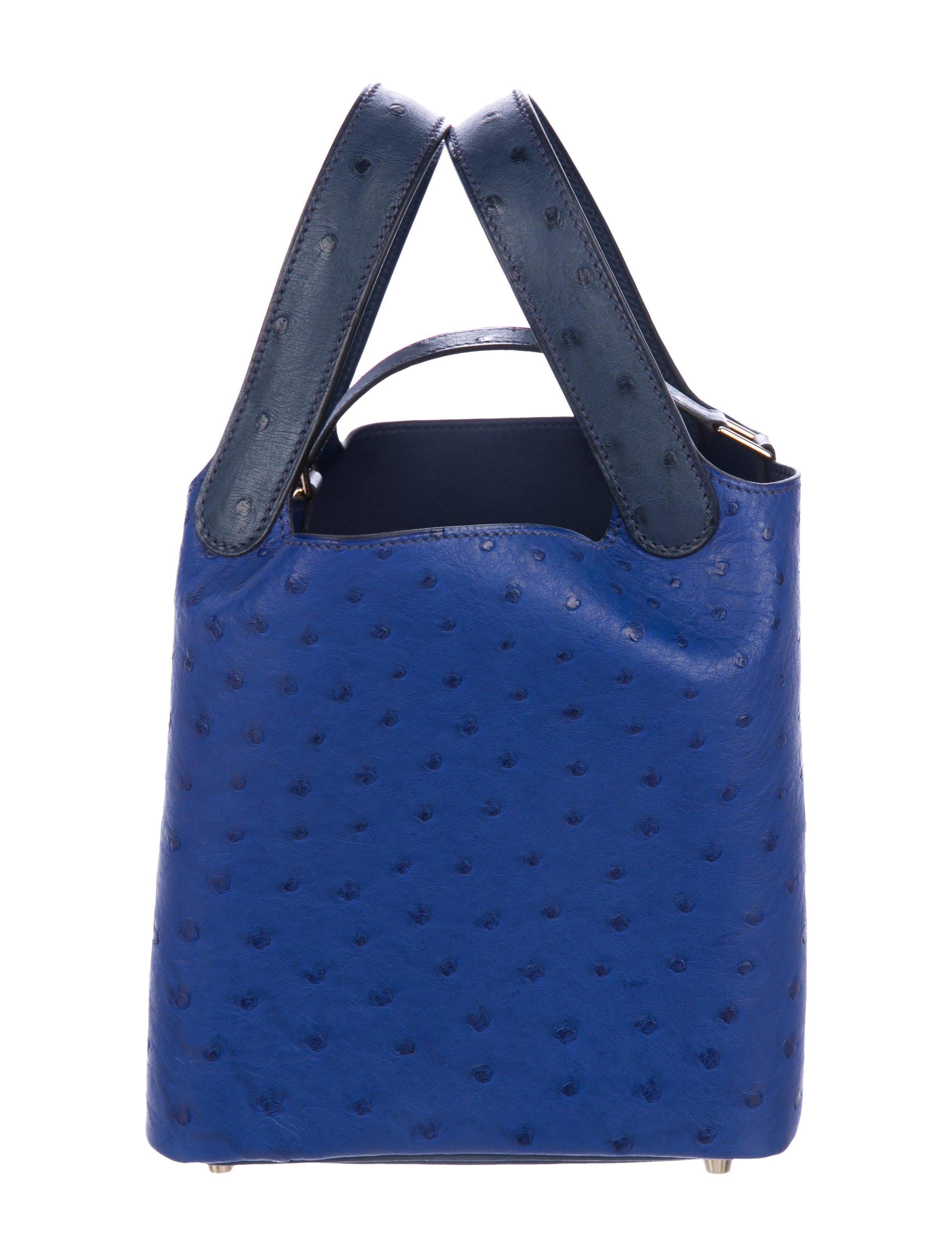 Hermes Leather Two Tone Blue Lock Evening Small Tote Top Handle Bucket Satchel Bag in Box

Ostrich
Leather
Palladium plated hardware
Leather lining 
Pull-through closure
Date code present
Handle drop 5.5