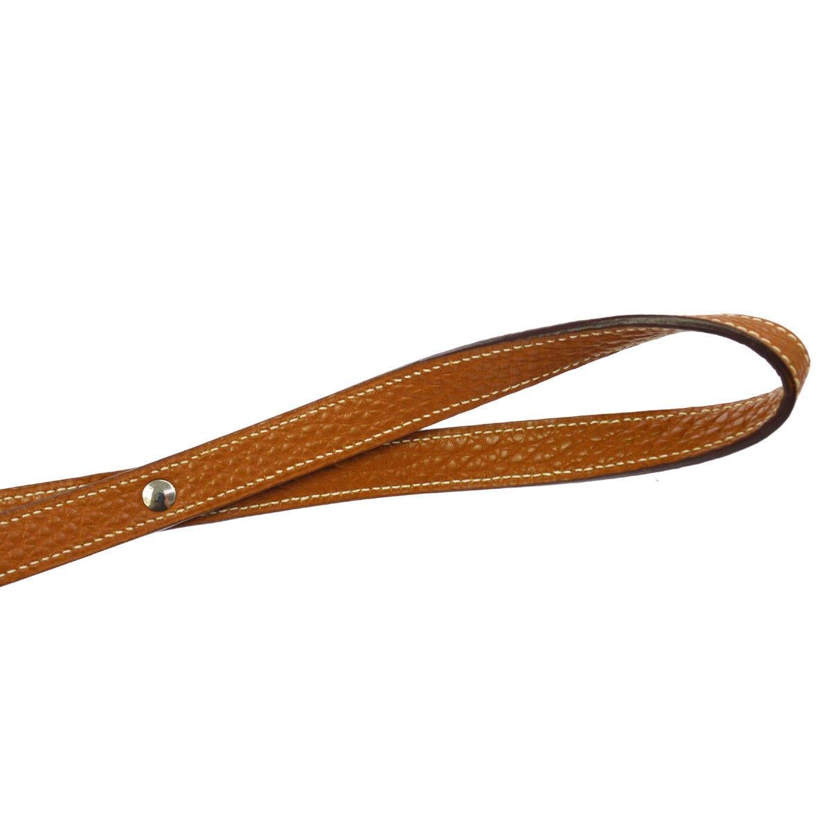 Hermes Cognac Brown Leather Silver Kelly Lock Dog Pet Animal Leash in Box

Leather
Palladium tone hardware 
Hook closure
Date code present
Made in France
Width 0.50