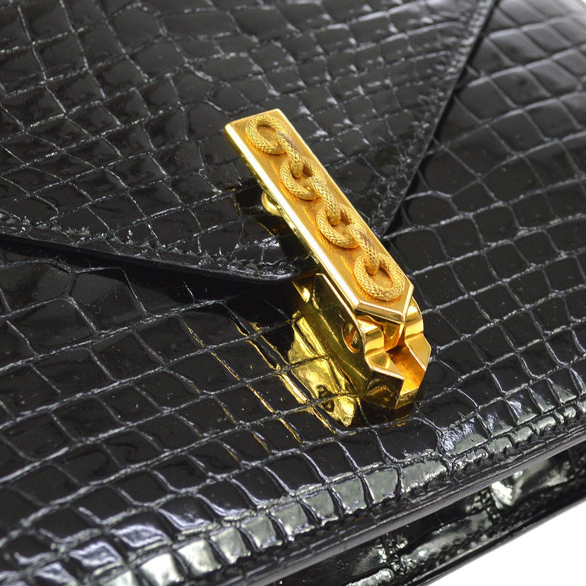 Hermes Rare Black Crocodile Leather Gold Emblem 2 in 1 Clutch Shoulder Flap Bag

Crocodile
Leather
Gold tone hardware
Leather lining
Shoulder strap drop 15.5