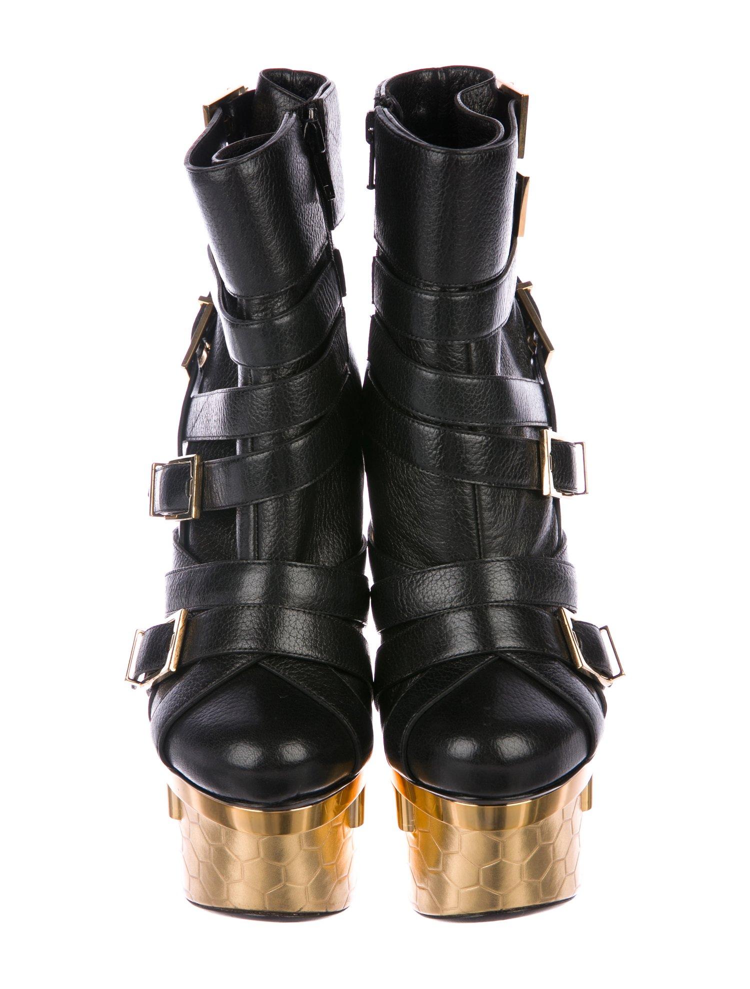 Versace NEW Runway Black Leather Gold Buckle Ankle Boots Booties in Box

Size IT 36
Leather
Metal
Resin
Gold tone
Buckle and zip closures
Made in Italy
Platform 2.75