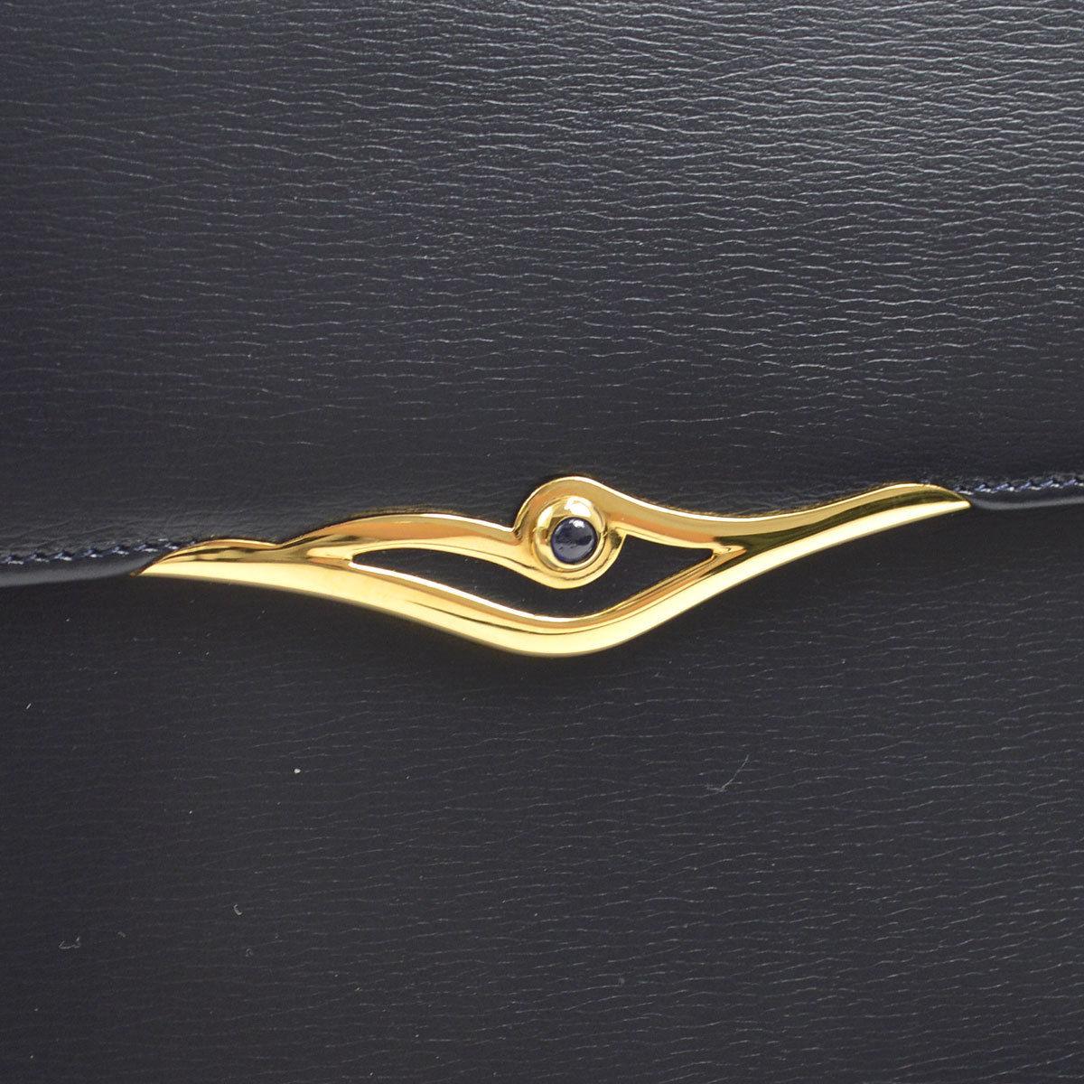 Cartier Dark Midnight Blue Leather Gold Emblem Envelope Evening Clutch Flap Bag

Leather
Gold tone hardware
Snap closure
Woven lining
Made in France
Measures 8.25