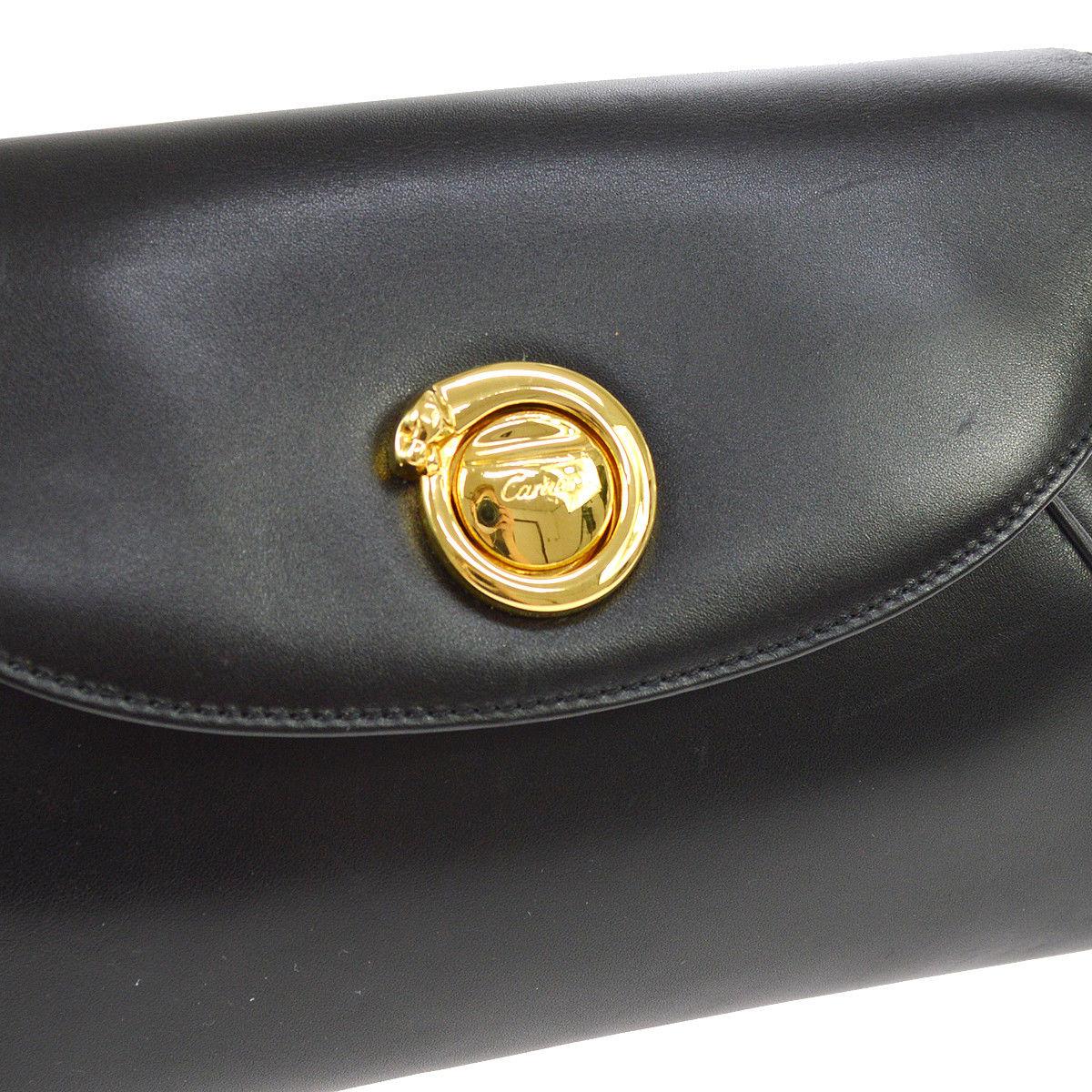 Cartier Black Leather Gold Emblem Envelope Evening Flap Clutch Bag

Leather
Gold tone hardware
Leather lining
Turnlock closure
Made in Italy
Date code present
Measures 11.5