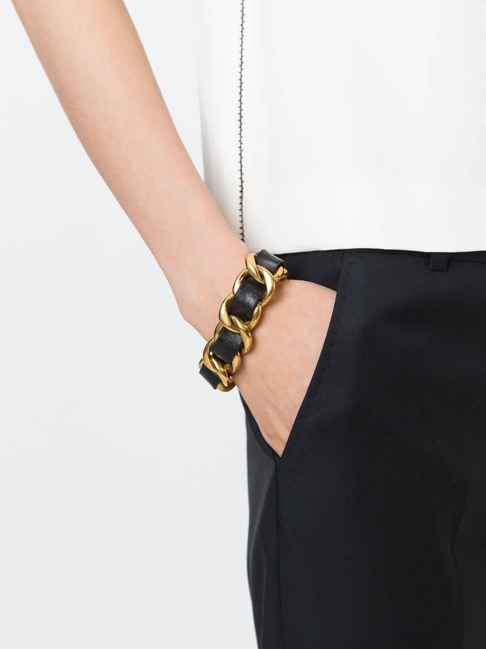 CURATOR'S NOTES

How about a little rock and roll wrapped around your pretty little wrist? Rockin' Chanel gold tone and black leather chain bracelet. 

Metal 
Gold tone
Leather
Hook and eye closure
Total length 7