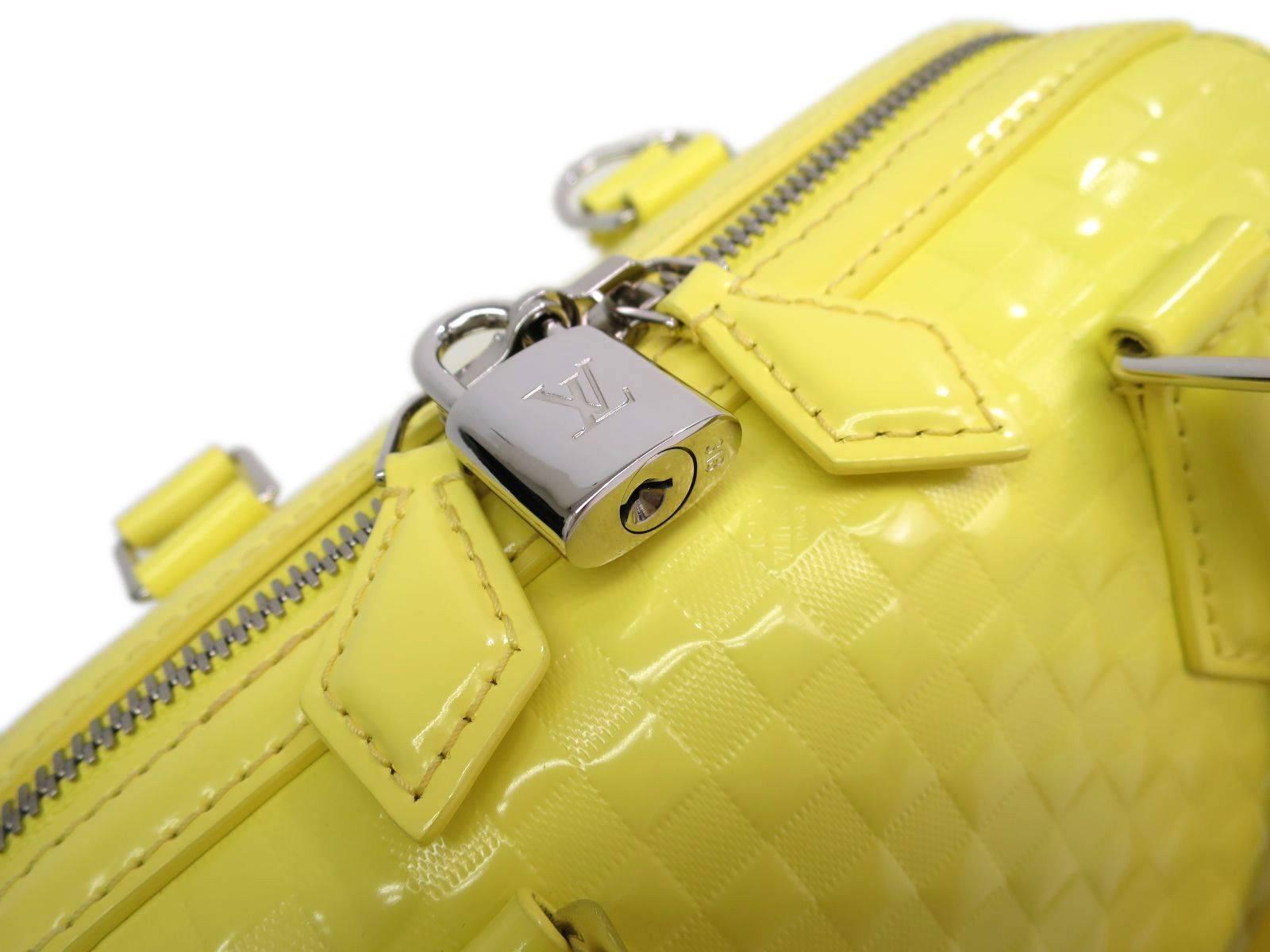 CURATOR'S NOTES

Can you say Louis Vuitton cubed? Eye-catching electric yellow, limited edition Louis Vuitton Speedy Cube bag with all original accessories. 

Style Tip: Wear it crossbody style or go hands-free and remove the shoulder strap for